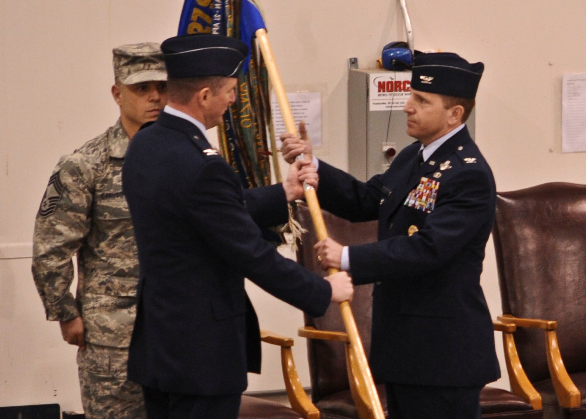 Col. James Slife (right) accepts command of the 27th Special Operations Group from Col. Stephen Clark, 27th Special Operations Wing commander, signifying the change of command. "I have never been more excited about an assignment and a chance to accomplish the mission than I am now," said Colonel Slife. (U.S. Air Force photo/Senior Airman Erik Cardenas)