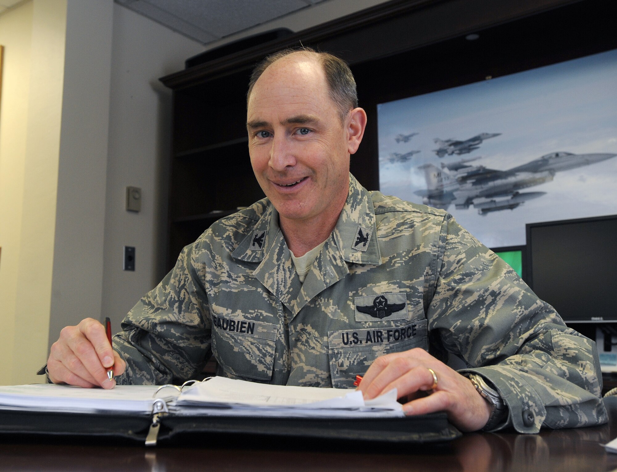 Col. Seth Beaubien, 319th Air Refueling Wing director of staff, poses for a photo March 8 in his new office on Grand Forks Air Force Base, N.D. Col. Don Shaffer, 319th Air Refueling Wing commander, recently announced that Colonel Beaubien will be the new director of staff, replacing Lt. Col. Brian J. Mahoney as he leaves on deployment. (U.S. Air Force photo by Tech. Sgt. Johhny Saldivar)