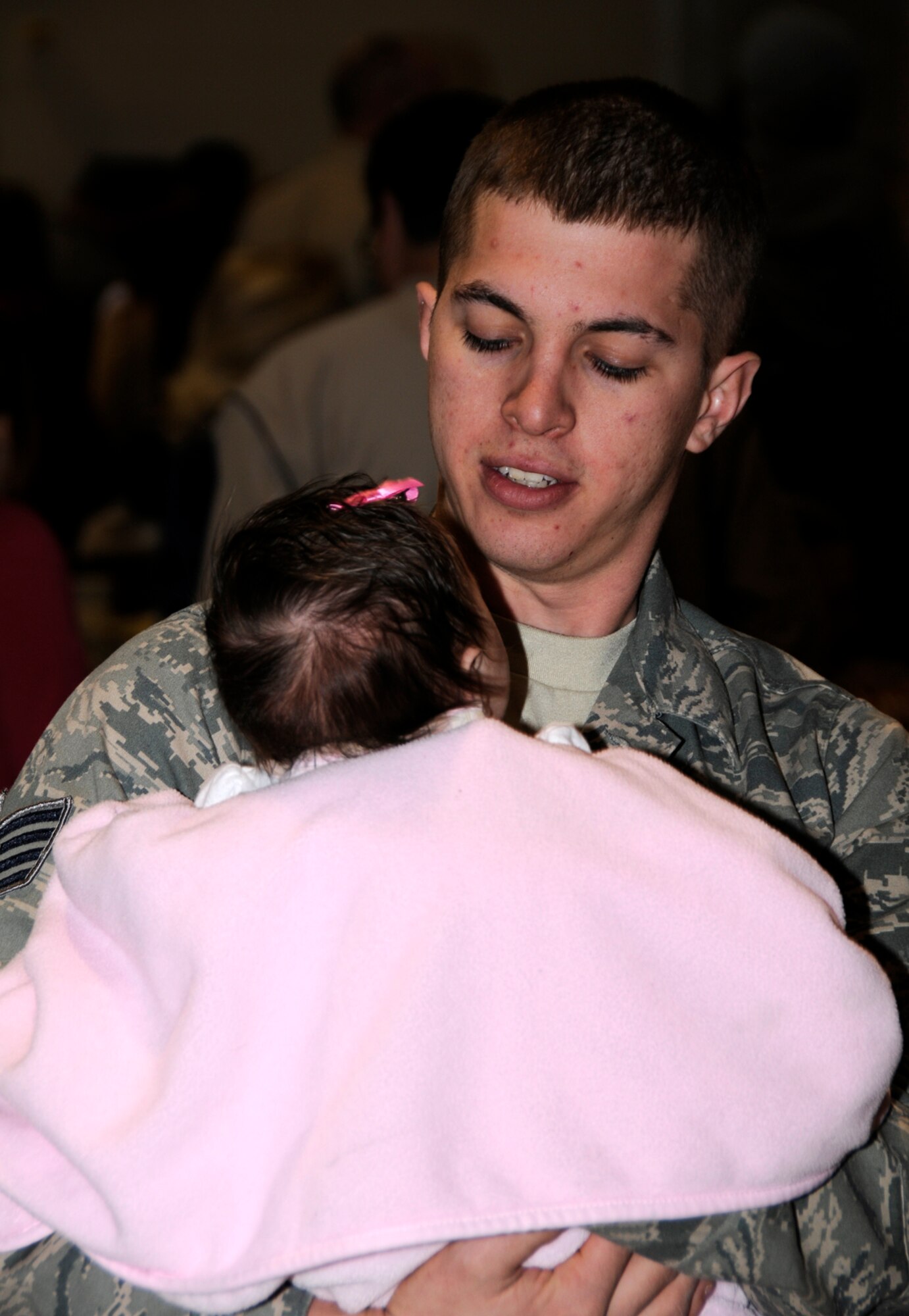 A member of the 188th Fighter Wing enjoys time with his family prior to departing for an Aerospace Expeditionary Forces deployment March 8, 2010, at Fort Smith, Ark. The 188th will be deployed to Kandahar, Afghanistan, for more than two months. The 188th will be attached to the 451st Expeditionary Wing while at Kandahar Airfield. This marks the 188th's first combat deployment with the A-10 Thunderbolt II "Warthog." (U.S. Air Force photo by Tech Sgt. Stephen M. Hornsey/188th Fighter Wing Public Affairs)
	
