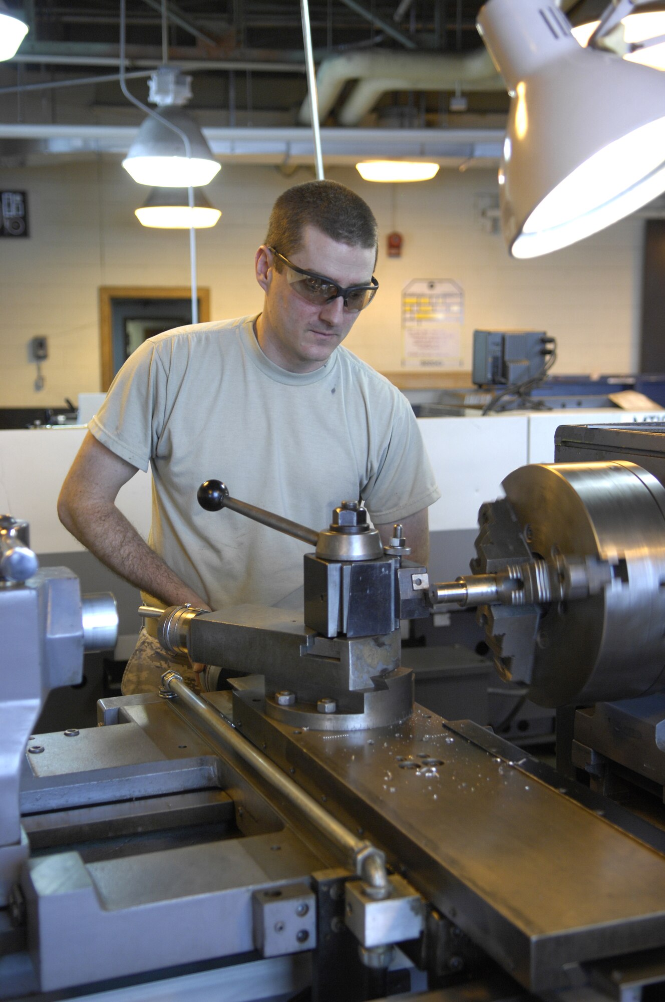 MINOT AIR FORCE BASE, N.D. – Staff Sgt. Thomas Woods, 5th Maintenance Squadron fabricationist, makes a washer from scratch March 5. Fabrication involves inspecting and creating even the smallest of parts for aircraft and machinery. (U.S. Air Force photo by Airman 1st Class Ashley N. Avecilla)