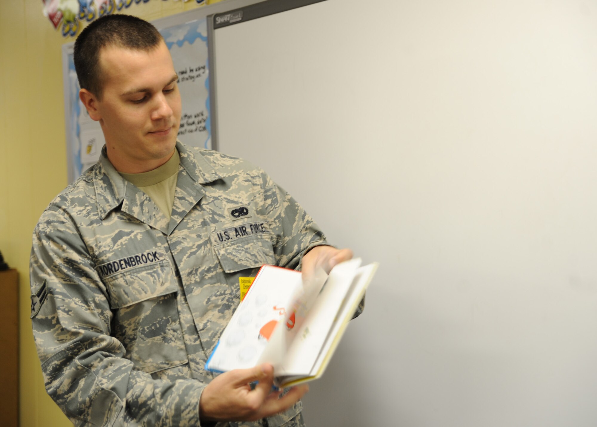 Airman 1st Class Nick Kordenbrock reads to a group of students March 2 at Oakbrook Elementary School in Ladson for Read Across America Week. The nationwide Read Across America Week celebration takes place each year on or around March 2, the birthday of children's author Dr. Seuss. Airman Kordenbrock is an analysis journeyman with the 437th Maintenance Operations Squadron. (U.S. Air Force photo/Senior Airman Katie Gieratz)
