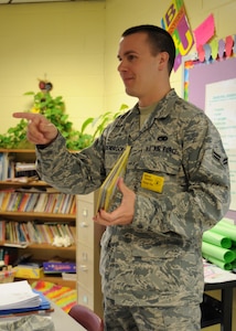 Airman 1st Class Nick Kordenbrock asks a group of students questions March 2 about the author Dr. Seuss after reading to them at Oakbrook Elementary School in Ladson. Airman Kordenbrock was one of seven Airmen from Joint Base Charleston who participated in reading to elementary school students for the nationwide Read Across America Week. Airman Kordenbrock is an analysis journeyman with the 437th Maintenance Operations Squadron. (U.S. Air Force photo/Senior Airman Katie Gieratz)