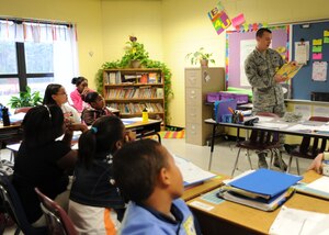 Airman 1st Class Nick Kordenbrock reads to a group of students March 2 at Oakbrook Elementary School in Ladson. Airman Kordenbrock was one of seven Airmen from Joint Base Charleston who participated in reading to elementary school students for the nationwide Read Across America Week. Airman Kordenbrock is an analysis journeyman with the 437th Maintenance Operations Squadron. (U.S. Air Force photo/Senior Airman Katie Gieratz)