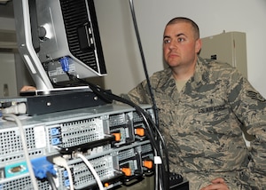 Staff Sgt. David M. Libby, 779th Medical Support Squadron deployed NCO in charge of medical information systems for the 380th Expeditionary Medical Group, checks over equipment in the medical clinic at a non-disclosed base in Southwest Asia March 4, 2010. Sergeant Libby cares for all the medical information equipment in the medical group. The 380 EMDG, as part of the 380th Air Expeditionary Wing, supports Operations IRAQI FREEDOM and ENDURING FREEDOM and the Combined Joint Task Force-Horn of Africa.