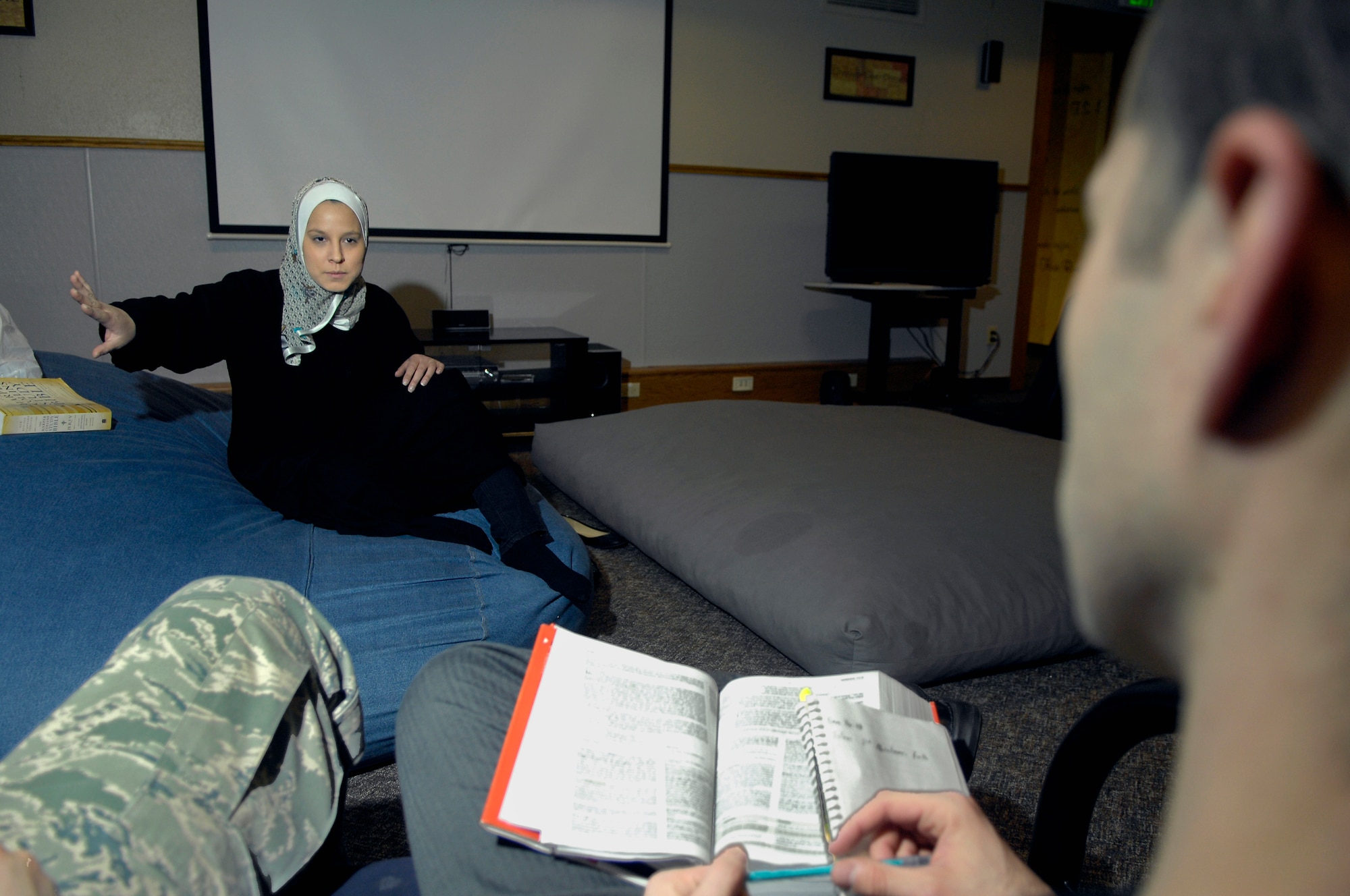MINOT AIR FORCE BASE, N.D. -- Airman 1st Class Ashley Avecilla, 5th Bomb Wing Public Affairs photographer, teaches a group of Airmen the basics of Islam during her “Introduction to Islam” class, which was held in the base community center at 5:30 p.m. Mar. 2. (U.S. Air Force photo by Senior Airman Benjamin Stratton)