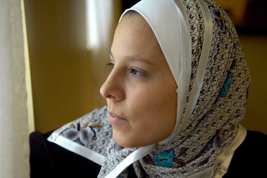MINOT AIR FORCE BASE, N.D. -- Airman 1st Class Ashley Avecilla, 5th Bomb Wing Public Affairs photographer, looks out the window as she prepares for her “Introduction to Islam” class, which was held in the base community center at 5:30 p.m. Mar. 2. (U.S. Air Force photo by Senior Airman Benjamin Stratton)