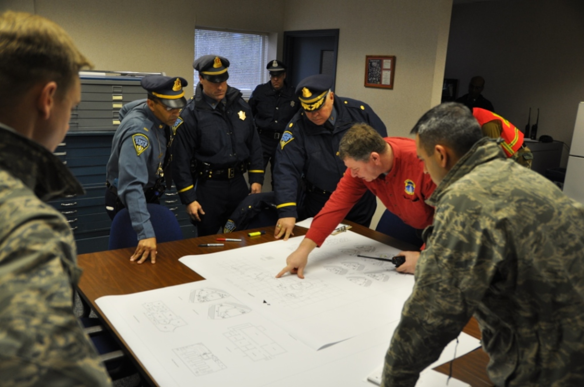 Steve Mellin, 6th Space Warning Squadron support officer, serves as liaison between the 6th SWS and Massachusetts State Police, Bourne Police Department, FBI, Massachusetts Military Reservation Fire Department, U.S. Coast Guard and Massachusetts Air National Guard’s102nd Intelligence Wingmedical and security forces personnel during a unified command crisis response exercise at Cape Cod Air Force Station Feb. 24. The 6th SWS is a geographically separated unit of the 21st Space Wing, and uses the Pave PAWS radar to guard North America’s East Coast against sea-launched and ICBMs. (U.S. Air Force photo/Master Sgt. Scott Crossman)