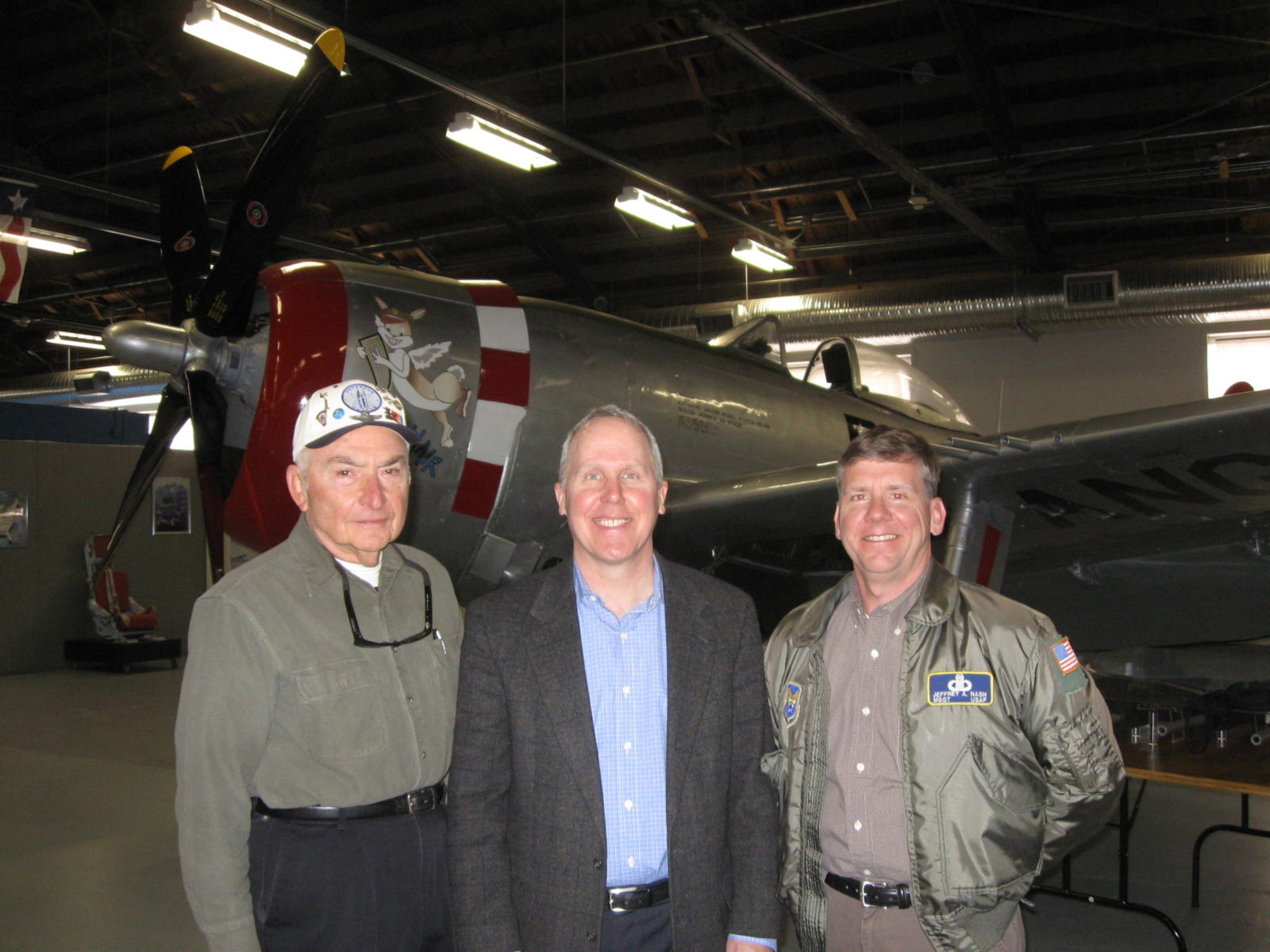 PETERSON AIR FORCE BASE, Colo. -- Dr. Thomas Jones, former NASA astronaut and veteran of four space shuttle missions, poses with retired Col. Gustav Freyer (left) and Jeff Nash (right), Peterson Air and Space museum assistant director and curator, Feb. 27 at the museum. Dr. Jones spent about two hours interacting with staff, visitors and signing copies of his book "Hell Hawks," the story of a P-47 "Thunderbolt" fighter group in Europe during World War II. (Courtesy photo)
