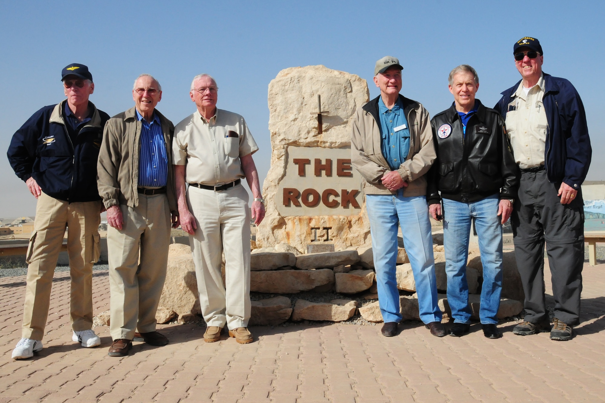 From left, U.S. Navy Retired Capt. Gene Cernan, U.S. Navy Retired Capt. Jim Lovell, Neil Armstrong, Bob Gilliland, U.S. Air Force Retired Brig. Gen. Steve Ritchie and David Hartman visit "The Rock", an undisclosed location in Southwest Asia during the "Legends of Aerospace" tour March 8, 2010. The group is visiting various military installations throughout Europe and Southwest Asia during the tour to share their groundbreaking aviation and aerospace experiences. (U.S. Air Force photo by Staff Sgt. Lakisha A. Croley/Released)