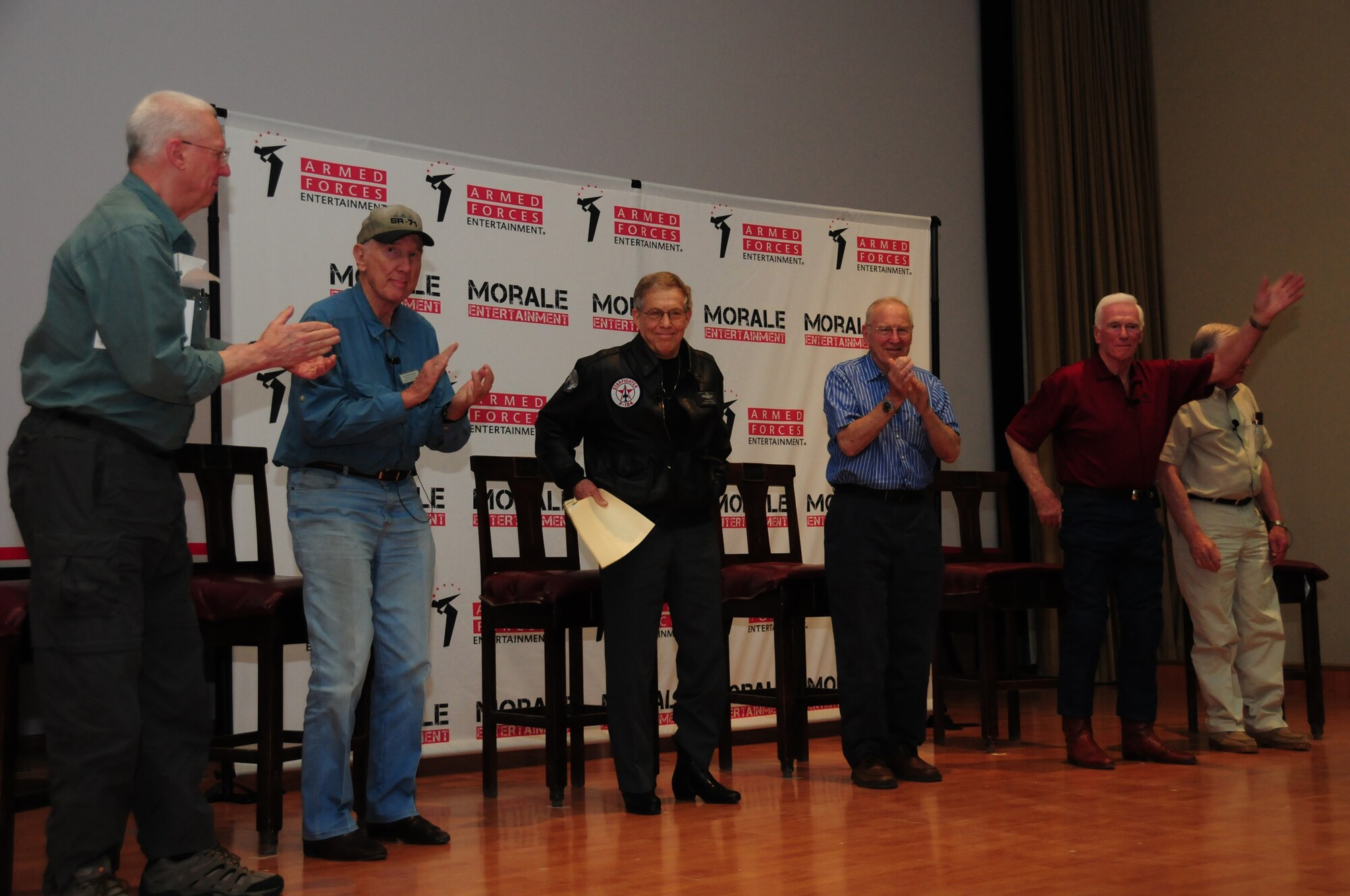 From left, David Hartman, Bob Gilliland, U.S. Air Force Retired Brig. Gen. Steve Ritchie, U.S. Navy Retired Capt. Jim Lovell, U.S. Navy Retired Capt. Gene Cernan and Neil Armstrong visit with servicemembers March 7, 2010 at an air base in Southwest Asia. During the visit, which was part of the "Legends of Aerospace" tour, the gentlemen shared their groundbreaking aviation and aerospace experiences in a panel discussion moderated by Mr. Hartman. The tour, sponsored by Armed Forces Entertainment in association with Morale Entertainment and American Airlines, will be traveling to various military installations throughout Europe and Southwest Asia. (U.S. Air Force photo by Staff Sgt. Lakisha A. Croley/Released)
