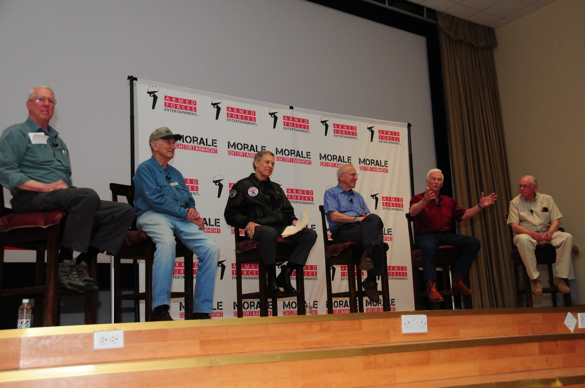 David Hartman, left, moderates the "Legends of Aerospace" panel discussion featuring from left, Bob Gilliland, U.S. Air Force Retired Brig. Gen. Steve Ritchie, U.S. Navy Retired Capt. Jim Lovell, U.S. Navy Retired Capt. Gene Cernan and Neil Armstrong March 7, 2010 at an air base in Southwest Asia. During the panel, which drew a crowd of hundreds, the legends shared their groundbreaking aviation and aerospace experiences. The visit was part of the "Legends of Aerospace" tour visiting various military installations throughout Europe and Southwest Asia. (U.S. Air Force photo by Staff Sgt. Lakisha A. Croley/Released)