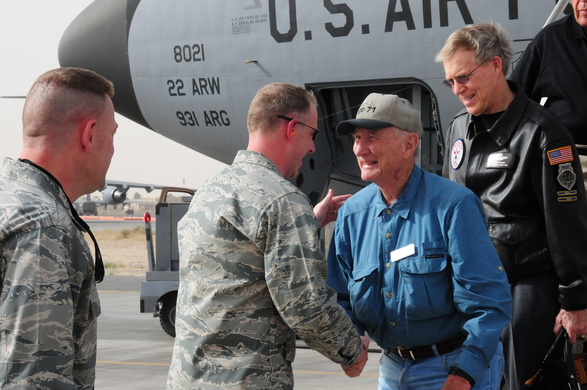 U.S. Air Force Col. John R. Gordy II, 386th Air Expeditionary Wing commander, welcomes Bob Gilliland and other "Legends of Aerospace" March 7, 2010 as they arrive at an air base in Southwest Asia. Mr. Gilliland and his fellow "Legends of Aerospace" are touring various military installations throughout Europe and Southwest Asia to share their groundbreaking aviation and aerospace experiences with those servicemembers serving overseas. (U.S. Air Force photo by Staff Sgt. Lakisha A. Croley/Released)