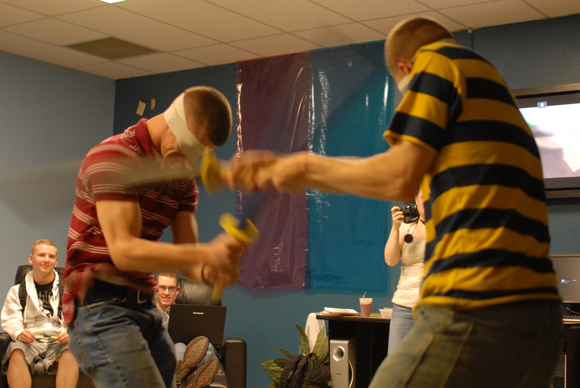 GOODFELLOW AIR FORCE BASE, Texas -- Marine Cpl. William Elkins III (left) duels against Airman 1st Class Jacob Mears during the mini Star Wars convention at the Crossroads, March 5, 2010. Cpl. Elkins is a student in the 316th Training Squadron. Airman Mears is a student in the 315th Training Squadron (U.S. Air Force photo/Staff Sgt. Laura R. McFarlane) 