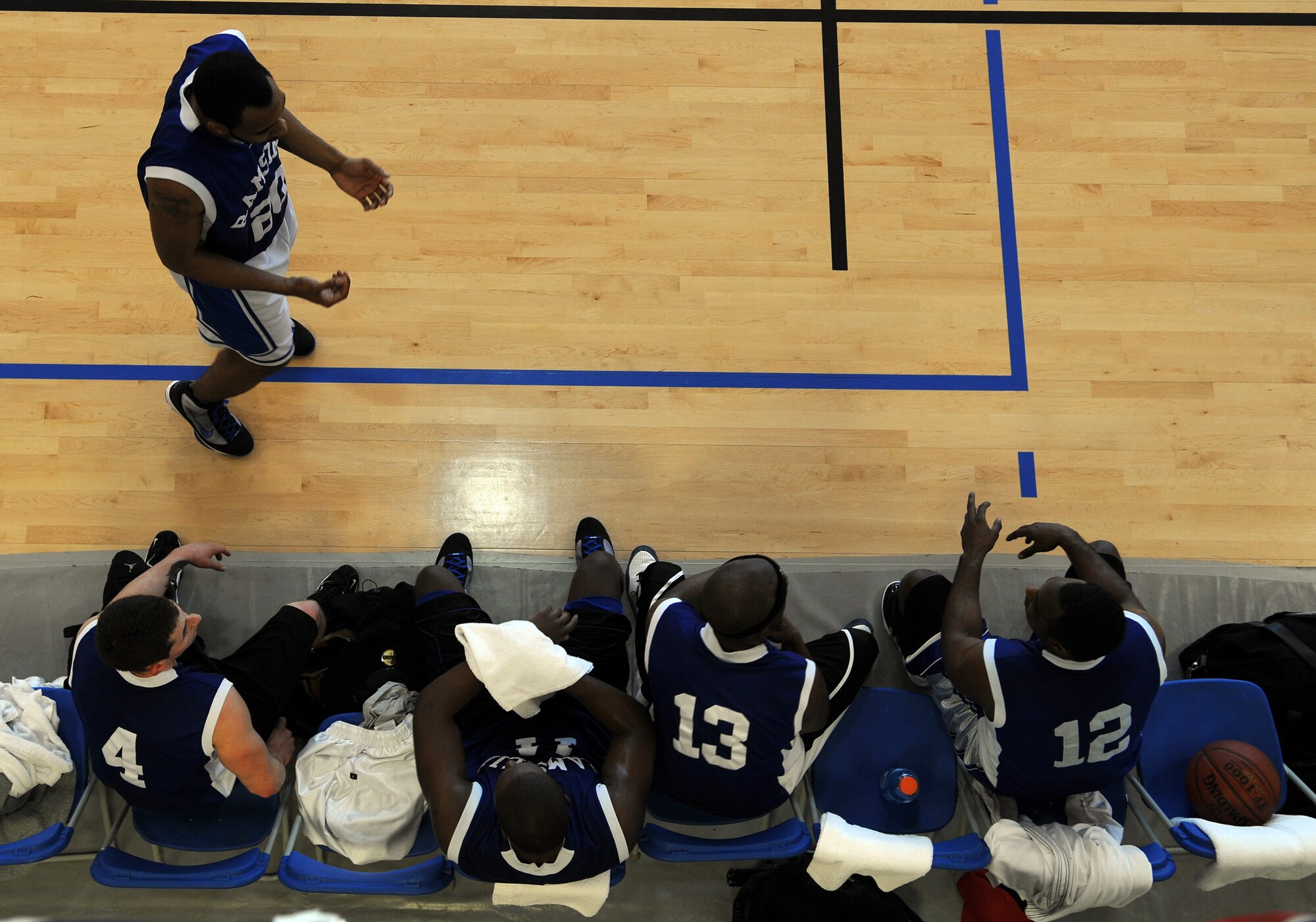 RAF MILDENHALL, England -- Players from the 86th Services Squadron try to develop a plan during halftime at the championship game of the 2010 U.S. Air Forces in Europe Small Unit/Intramural Basketball Championships at the Hardstand Fitness Center here March 7. The 86th SVS lost the title to the 86th Communication Squadron in a 91-86 game. (U.S. Air Force photo/Staff Sgt. Thomas Trower)