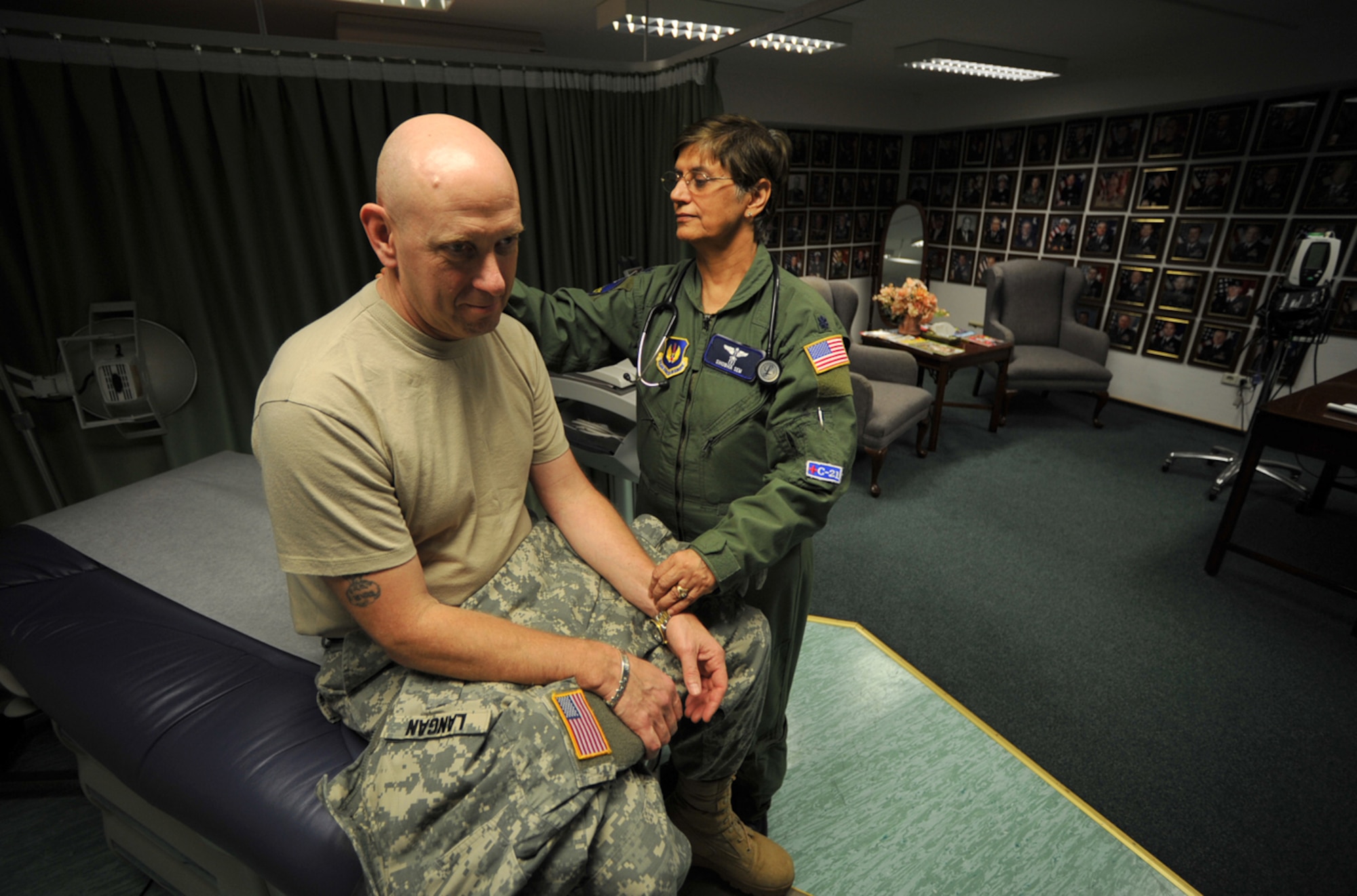 U.S. Army Col. William Langan, Office of Defense Cooperation Cyprus, gets a medical examination from U.S. Air Force Lt.Col. (Dr.) Shobha Sem, 86th Medical Group Special Operations during the U.S. European Command European Strategy Conference, Ramstein Air Base, Germany, March 2, 2010. During the week-long conference, attendees were able to bring all their medical care up to date thanks to the hard work of the 86th Medical Group and their concept of “Conference Medicine.” (U.S. Air Force photo by Senior AIrman Tony R. Ritter)