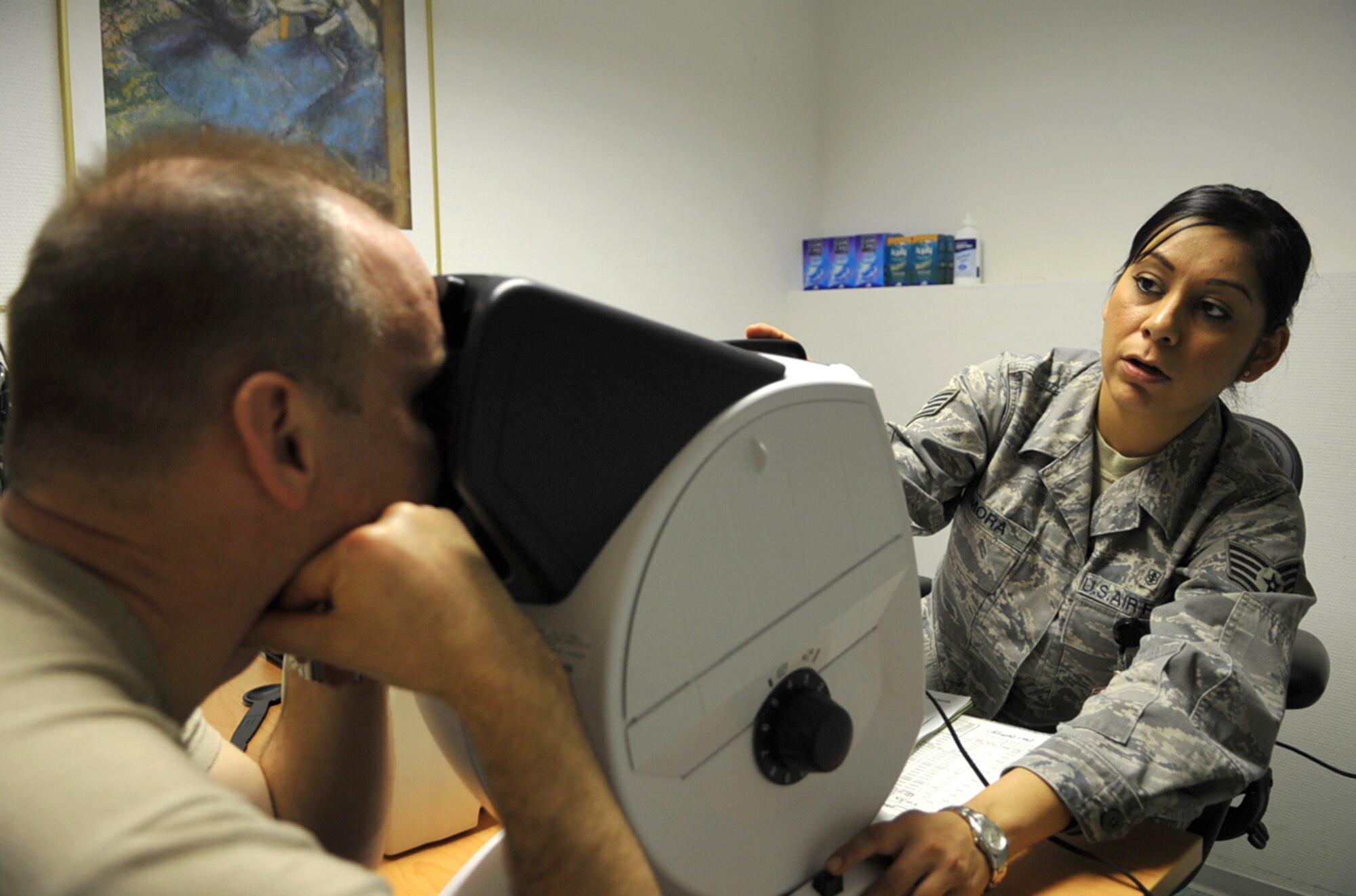 U.S. Army Lt.Col. Charles Davis, Office of Defense Cooperation Croatia, gets an eye exam from U.S. Air Force Staff Sgt. Liliana Zamora, medical technician, 86th Medical Group Special Operations during the U.S. European Command European Strategy Conference, Ramstein Air Base, Germany, March 2, 2010. During the week-long conference, attendees were able to bring all their medical care up to date thanks to the hard work of the 86th Medical Group and their concept of “Conference Medicine.” (U.S. Air Force photo by Senior AIrman Tony R. Ritter)