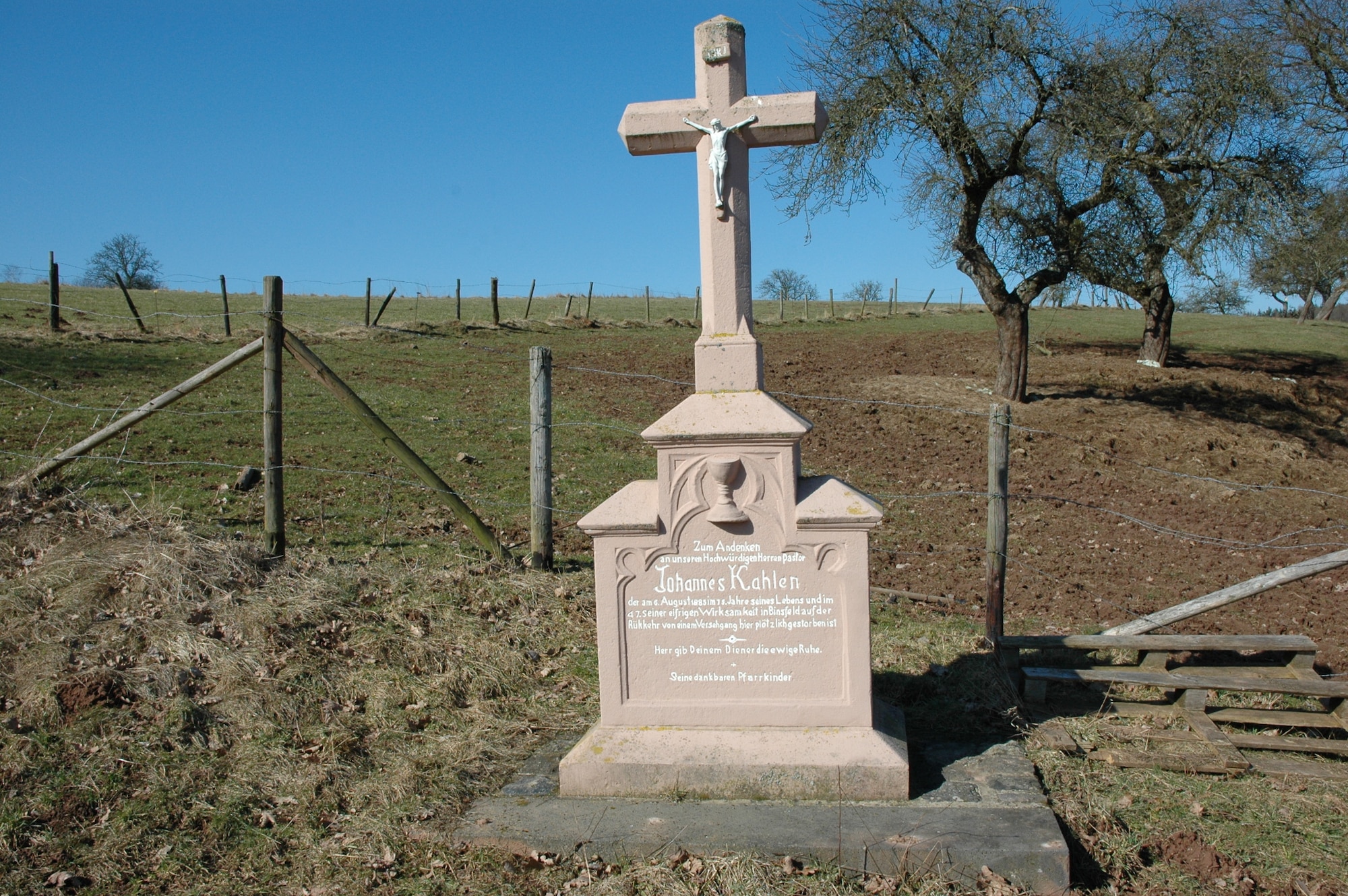 SPANGDAHLEM AIR BASE, Germany -- This cross located near Binsfeld was erected on Aug. 6, 1985, to honor a local priest who died at the age of 75 after returning from a parishioner’s death bed. The priest’s cross is one of the first in the Eifel area to be built like a memorial stone rather than the slim crosses of the past. (U.S. Air Force photo by Iris Reiff)