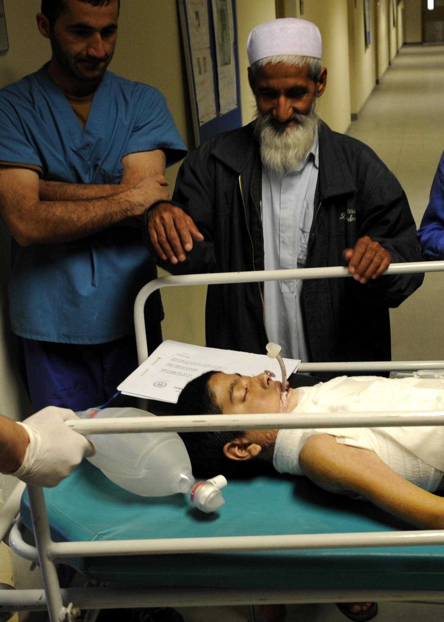 Abdul Ghafer is relieved his son, Abdul Rahman, made it through five hours of surgery.  More surgeries are expected due to the extent of his injuries.  (U.S. Air Force photo by Senior Airman Nancy Hooks/Released)