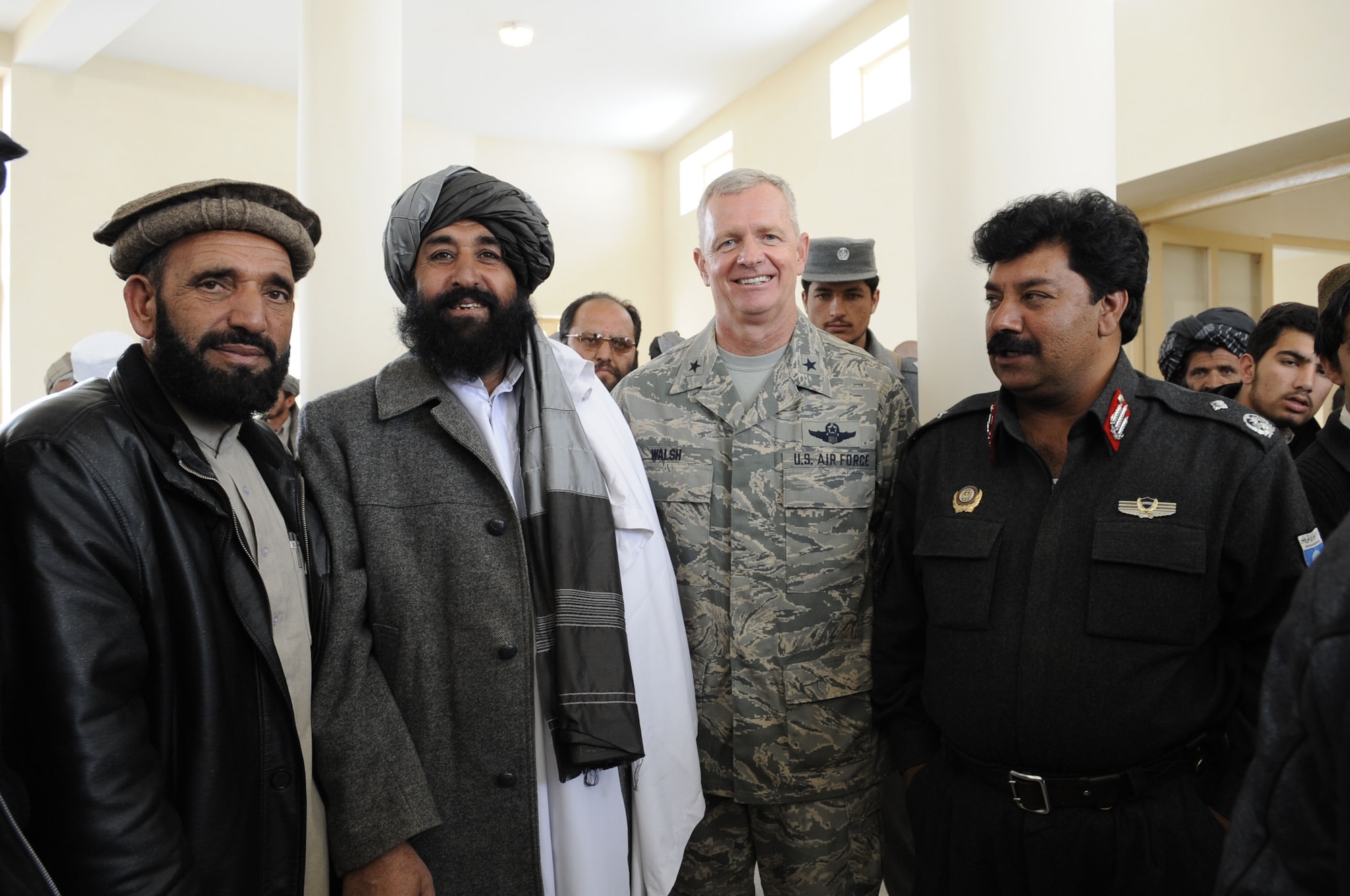 From left, Al-Haj Gulab Shah Alikhel, Deputy Governor of Zabul province, revered former Mujahideen commander Rasoulyak, Brig. Gen. Guy Walsh, 451st AEW commander and  Brig. Gen. Abdul Rahman Sarjang, Zabul Provincial Chief of Police attend the ribbon-cutting ceremony for the boy’s school in Qalat, Zabul, Feb. 25. (U.S. Air Force photo by Senior Airman Nancy Hooks/Released)
