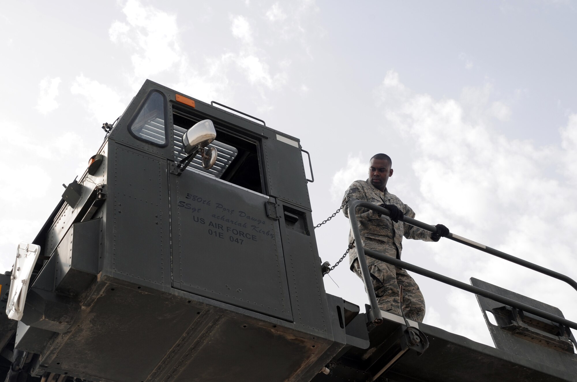 Staff Sgt. Phillip Belnavis , an air transportation craftsman with the 380th Expeditionary Logistics Readiness Squadron's Air Terminal Operations Center at a non-disclosed base in Southwest Asia, works on the 60,000-pound-capable aircraft loader during operations on the flightline of his deployed base March 1, 2010. He is deployed from the 89th Aerial Port Squadron at Andrews Air Force Base, Md., and his hometown is Pembroke Pines, Fla. (U.S. Air Force Photo/Master Sgt. Scott T. Sturkol/Released)
