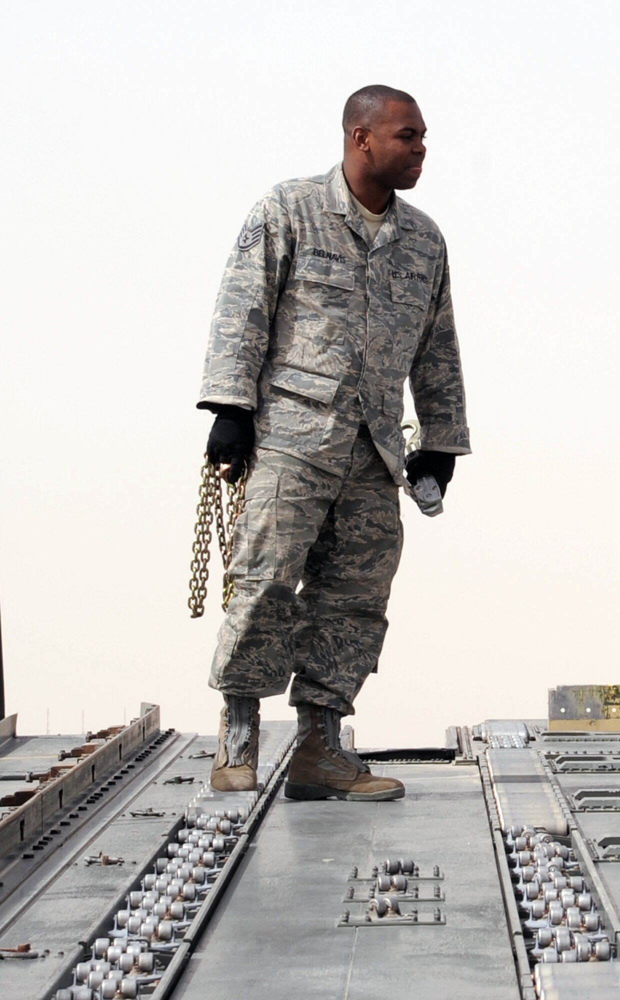 Staff Sgt. Phillip Belnavis , an air transportation craftsman with the 380th Expeditionary Logistics Readiness Squadron's Air Terminal Operations Center at a non-disclosed base in Southwest Asia, works on the 60,000-pound-capable aircraft loader during operations on the flightline of his deployed base March 1, 2010. He is deployed from the 89th Aerial Port Squadron at Andrews Air Force Base, Md., and his hometown is Pembroke Pines, Fla. (U.S. Air Force Photo/Master Sgt. Scott T. Sturkol/Released)
