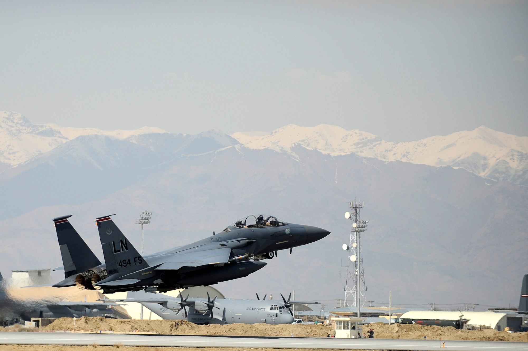 U.S. Ambassador to Afghanistan Karl Eikenberry and Brig. Gen. Steven Kwast, commander, 455th Air Expeditionary Wing, take off at Bagram Airfield, Afghanistan, March 5, 2010. Ambassador Eikenberry was at Bagram to get an orientation flight in a 494th Expeditionary Fighter Squadron F-15E Strike Eagle. (U.S. Air Force photo by/ Tech. Sgt. Jeromy K. Cross/released)