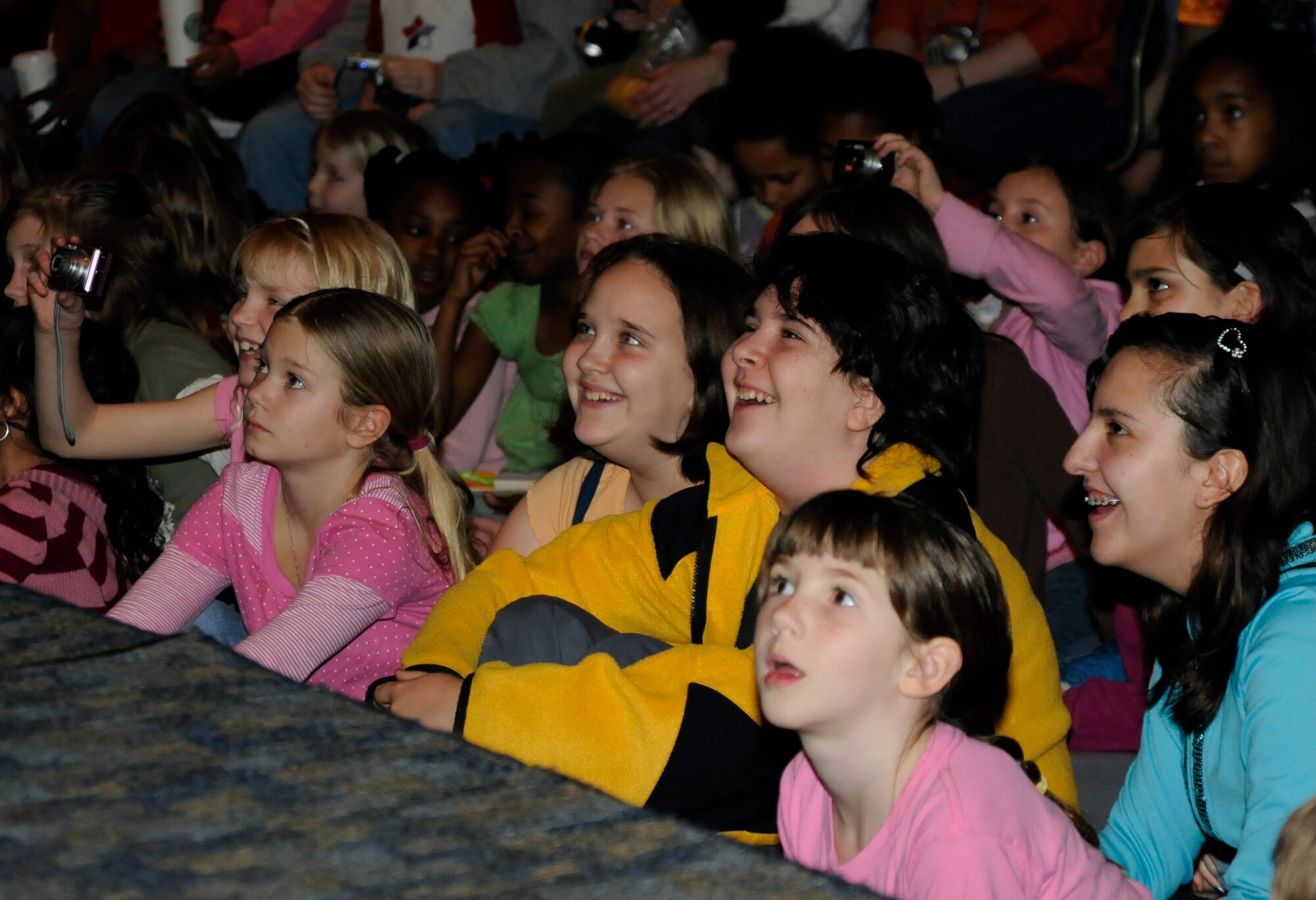 Incirlik children react to a story told about the first landing on the moon Saturday, March 6, 2010 during the “Legends of Aerospace” tour at Incirlik Air Base, Turkey. David Hartman, retired United States Air Force officer and original Host of ABC’s Good Morning America, joined legends Neil Armstrong, Gene Cernan, Bob Gilliland, Jim Lovell and Steve Ritchie for a Morale Entertainment supported tour to meet with thousands of troops overseas and honor their defense of freedom. (U.S. Air Force photo/Airman 1st Class Amber Ashcraft)