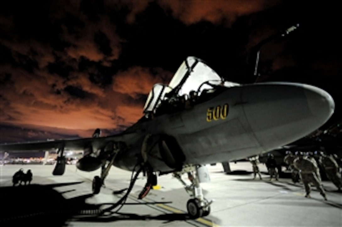 U.S. Navy sailors from Tactical Electronic Warfare Squadron 139 out of Naval Air Facility Washington, D.C., prepare to launch an EA-6B Prowler aircraft at Nellis Air Force Base, Nev., during Red Flag 10-3 on March 2, 2010.  Red Flag is a realistic combat training exercise involving the air forces of the United States and its allies.  The exercise is conducted on the 15,000-square-mile Nevada Test and Training Range north of Las Vegas.  