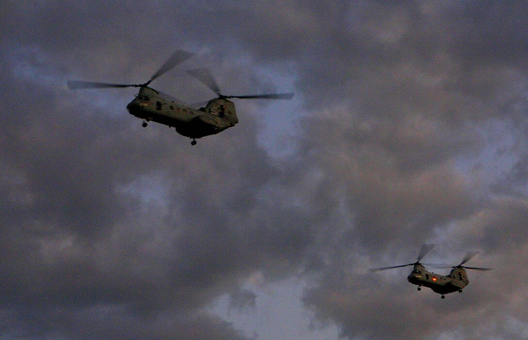 Two CH-46E Sea Knights with Marine Medium Helicopter Squadron 265 Reinforced (HMM-265 REIN) approach a landing zone objective during a mock helicopter raid, March 10. Servicemembers from the Armed Forces of the Philippines (AFP) and the 31st Marine Expeditionary Unit (MEU) are training together during Balikatan 2010 (BK ’10) to hone their civil-military interoperability skills to ensure more responsive, efficient and effective relief efforts.