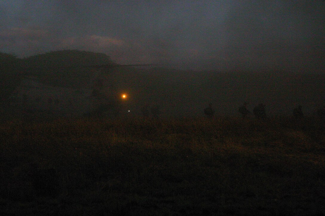 Servicemembers from the Armed Forces of the Philippines (AFP) and the 31st Marine Expeditionary Unit (MEU) disembark a CH-46E Sea Knight during a mock helicopter raid, March 10. The two nation’s forces are training together during Balikatan 2010 (BK ’10) to hone their civil-military interoperability skills to ensure more responsive, efficient and effective relief efforts.