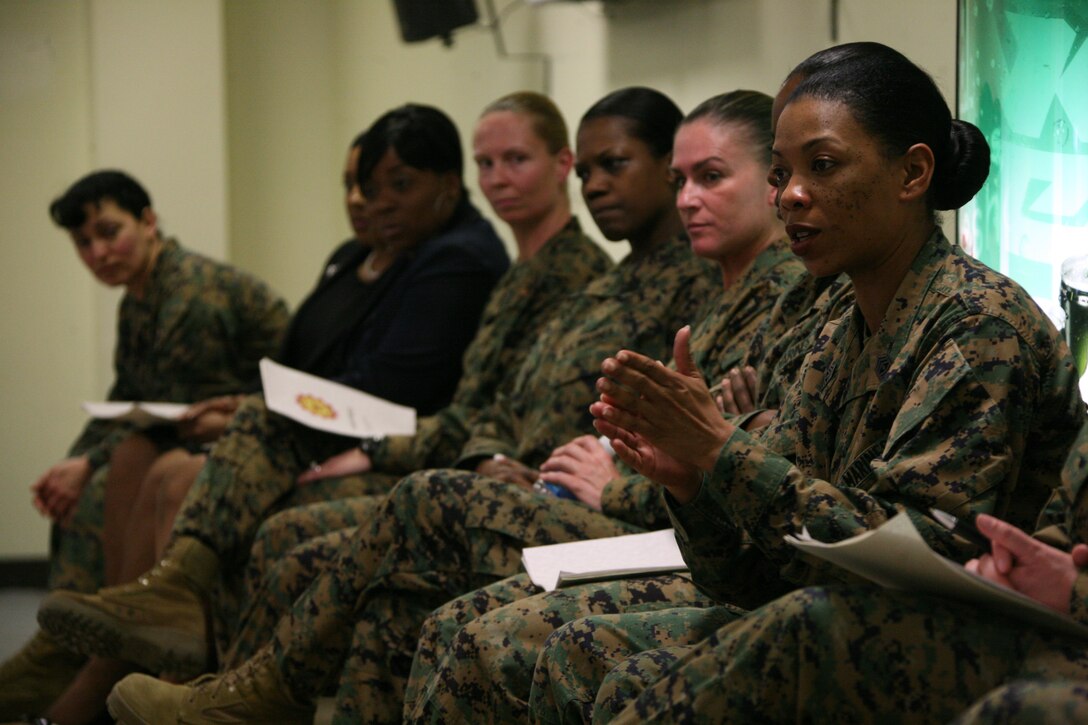 1st Sgt. Roxanne R. Collins, the first sergeant of Camp Lejeune’s Engineer Maintenance Company, 2nd Maintenance Battalion, addresses about 50 Marines at the air station’s Aerial Port of Embarkation, March 10. Collins and 10 other senior female leaders from across the Corps visited Cherry Point for a gathering in appreciation of women’s history month. The senior leaders spoke about their experiences during their military careers and offered guidance to junior Marines.