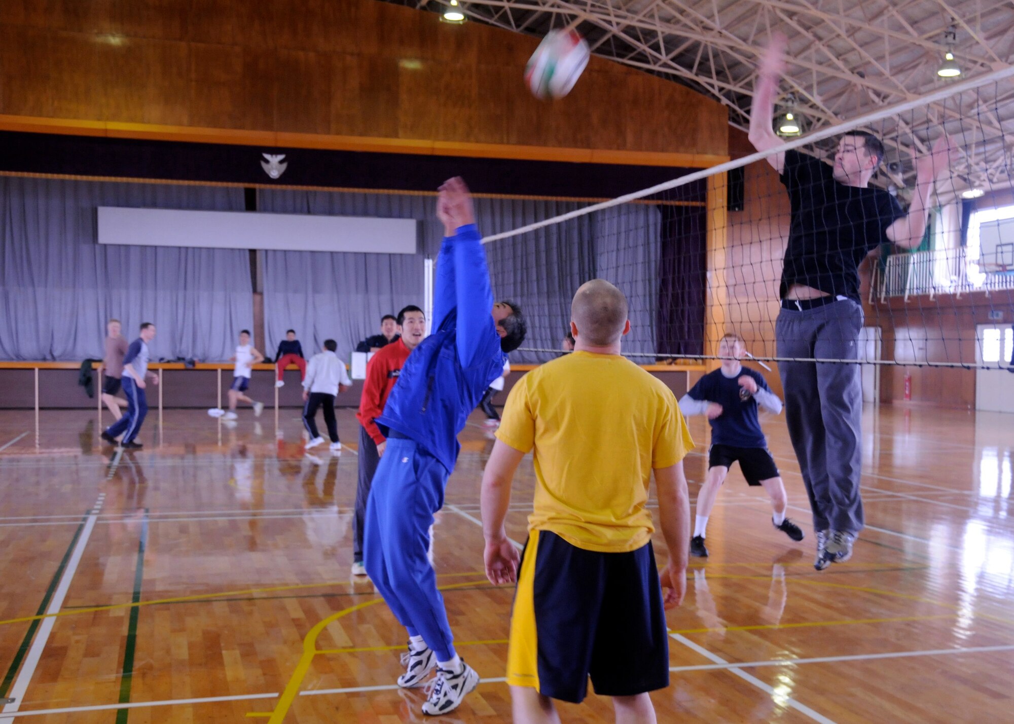 TSUIKI AIR BASE, Japan ? Capt. Ryan Cross, 14th Fighter Squadron pilot, jumps to block a hit by a Japan Air Self-Defense Force pilot during a volleyball tournament at the base gym March 9. The tournament took place on the second day of a weeklong aviation training relocation exercise scheduled for March 8-12. (U.S. Air Force photo/Staff Sgt. Rachel Martinez)