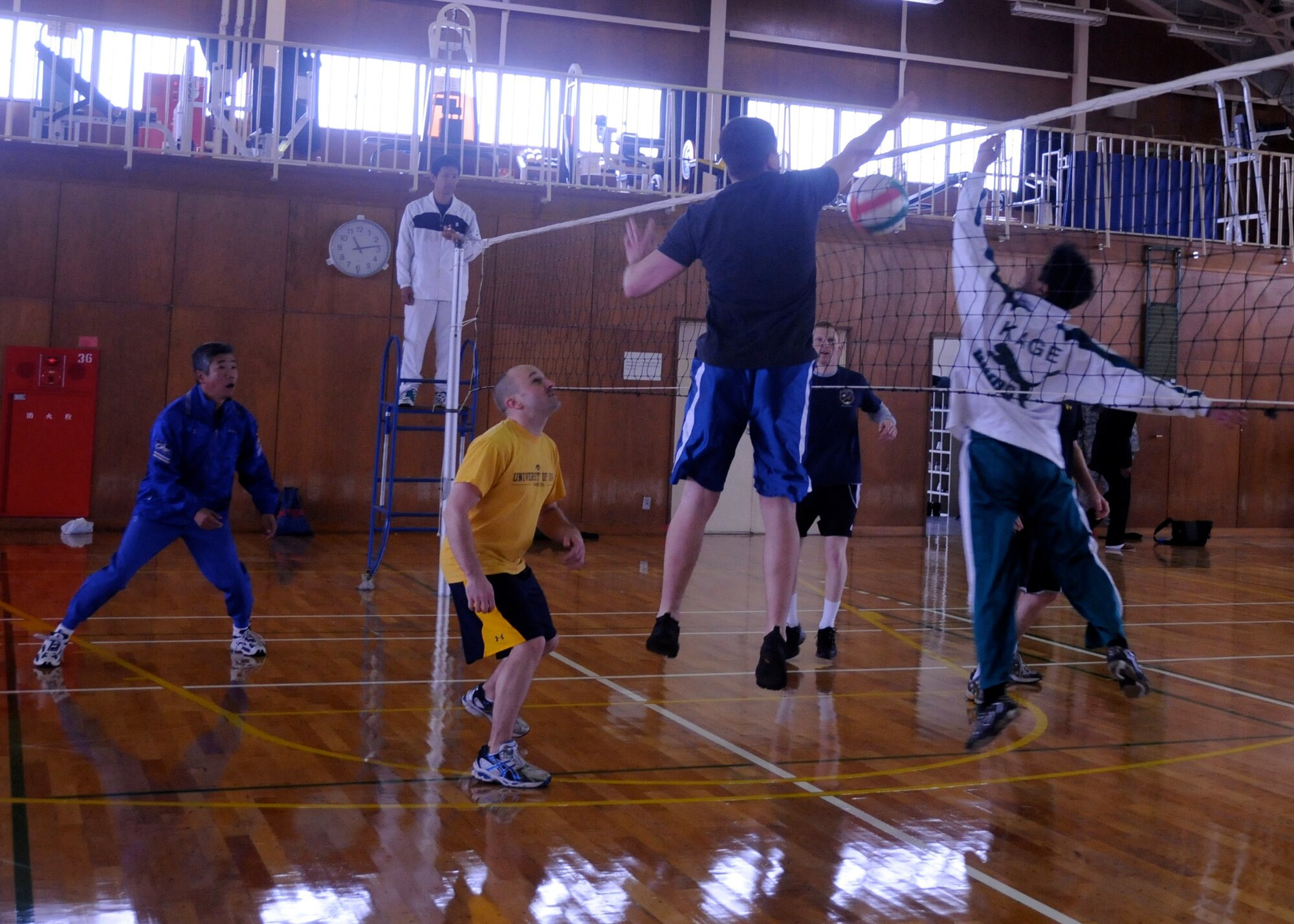 TSUIKI AIR BASE, Japan ? U.S. Air Force and Japan Air Self-Defense Force pilots go head-to-head in a volleyball tournament at the base gym after poor weather cancelled flying operations March 9. Pilots from both countries are taking part in a weeklong aviation training relocation exercise. The volleyball tournament offered the pilots a chance to interact with each other in a more social setting. (U.S. Air Force photo/Staff Sgt. Rachel Martinez)