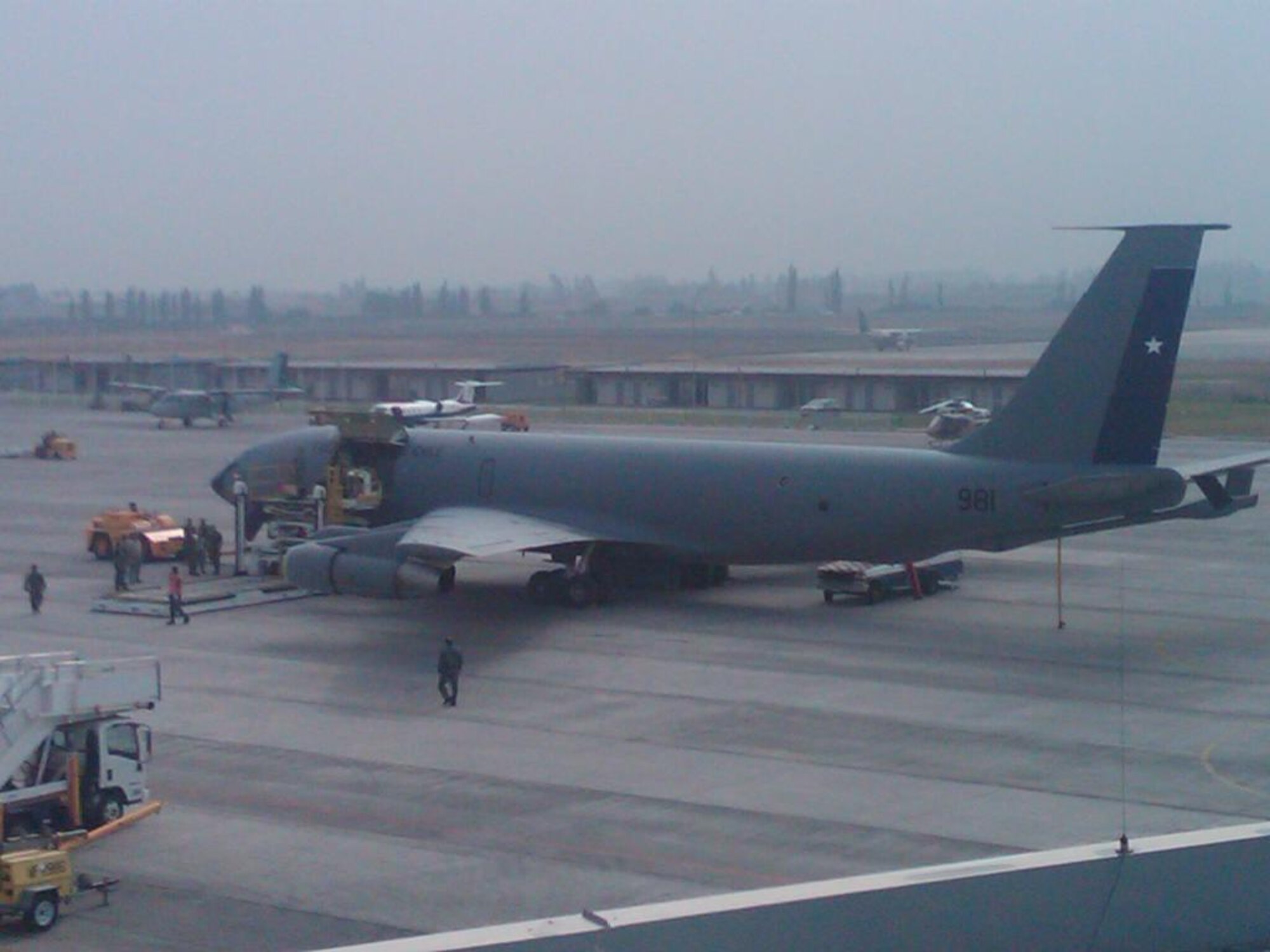 Chilean air force members unload cargo off of a KC-135E on a ramp in Santiago, Chile March 2. The flying and maintenance training for the KC-135E aircraft Sheppard instructors originally planned, transformed into humanitarian operations now supporting earthquake efforts. (Photo Courtesy)