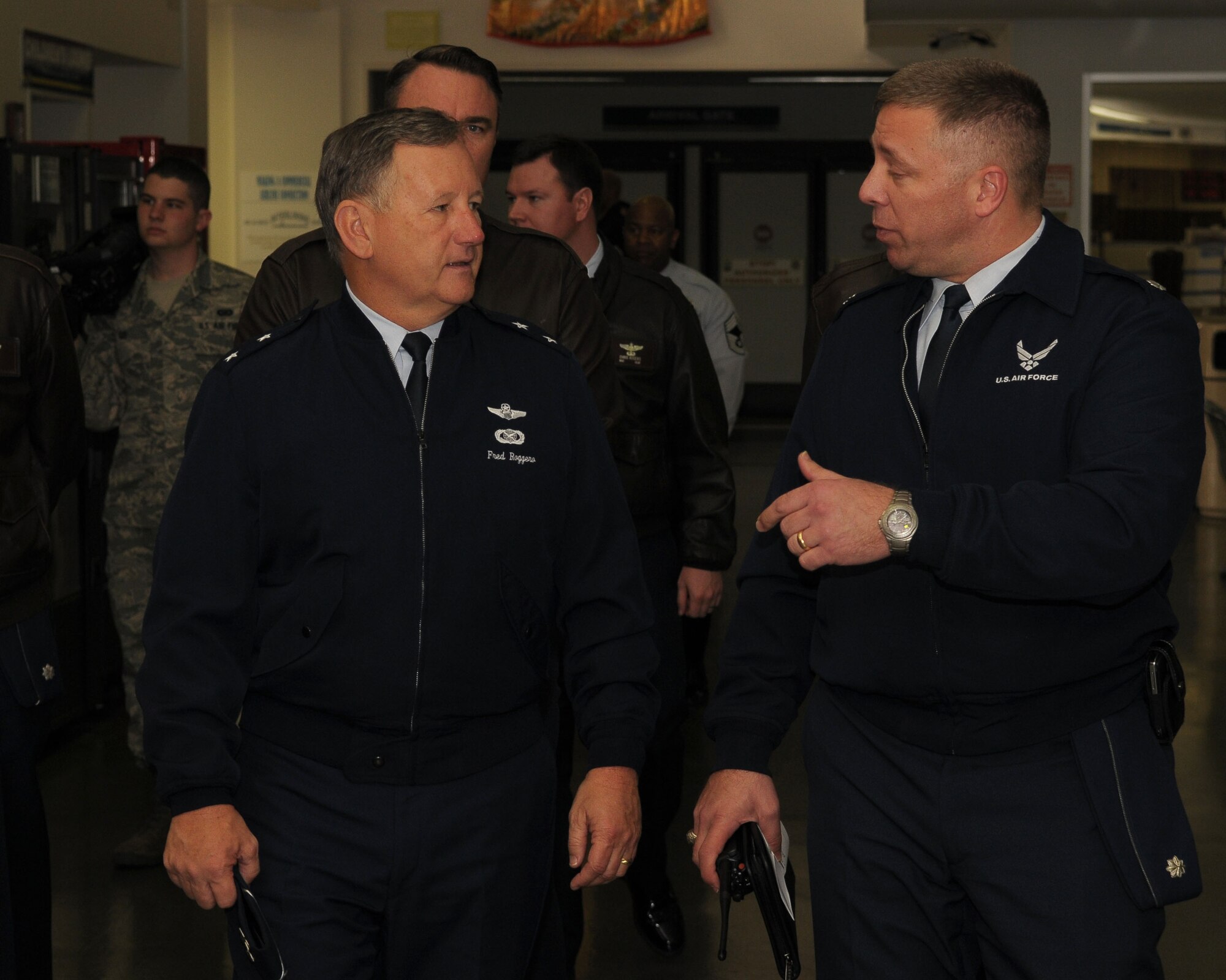 YOKOTA AIR BASE, Japan -- Lieutenant Col. Darren Sprunk, 730th Air Mobility Squadron (right), briefs Maj. Gen. Frederick Roggero, Air Force Chief of Safety, about the daily activities at the Passenger Terminal here Mar. 8. Gen. Roggero visited Yokota during his tour of Pacific Air Bases. (U.S. Air Force/Airman 1st Class Sean Martin)