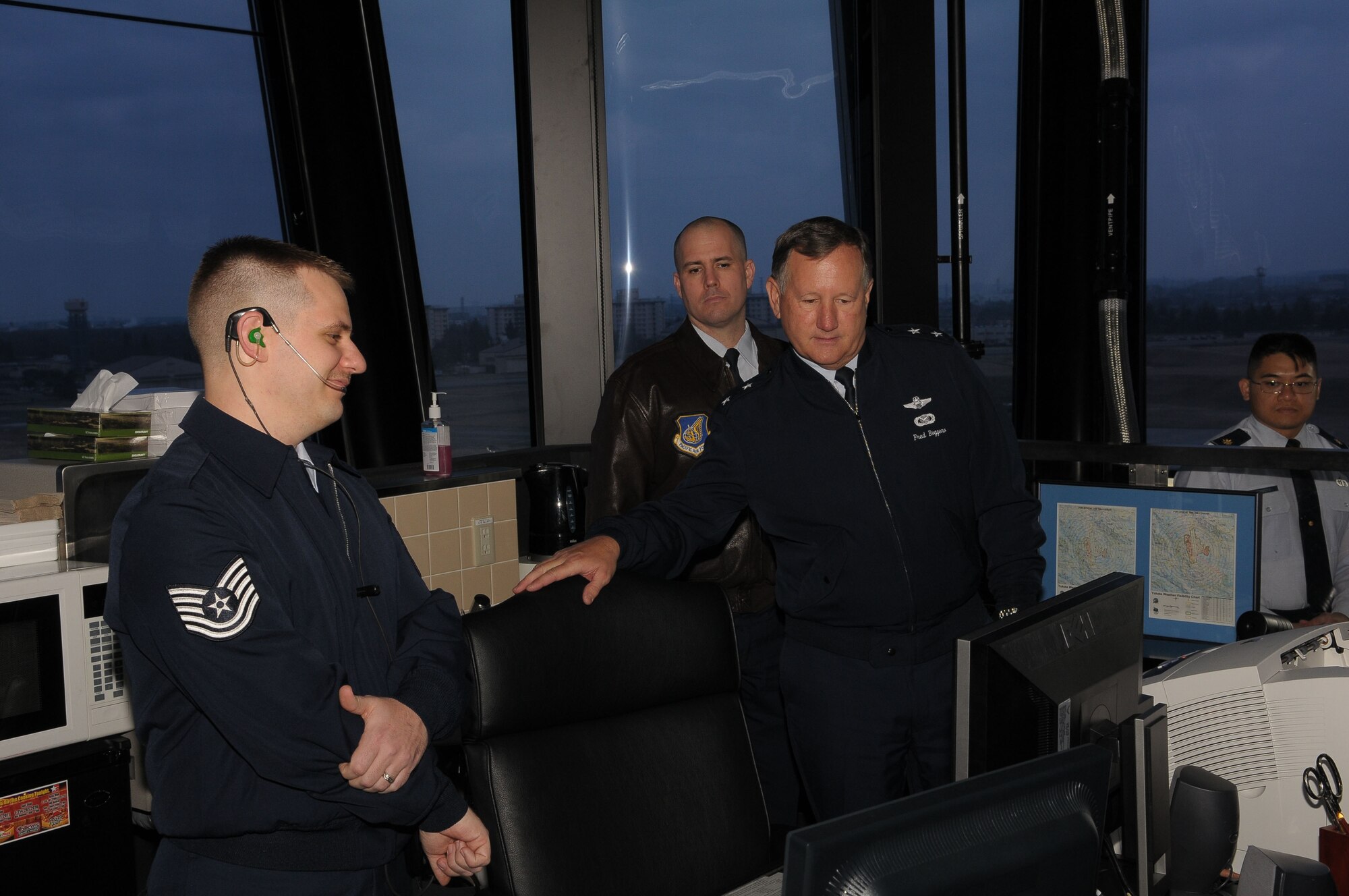 YOKOTA AIR BASE, Japan -- Maj. Gen. Frederick Roggero, Air Force Chief of Safety, looks at a computer display Mar. 8 in the Radar approach control facility and tower.  Gen. Roggero visited Yokota during his tour of Pacific Air Bases. (U.S. Air Force/Airman 1st Class Sean Martin)