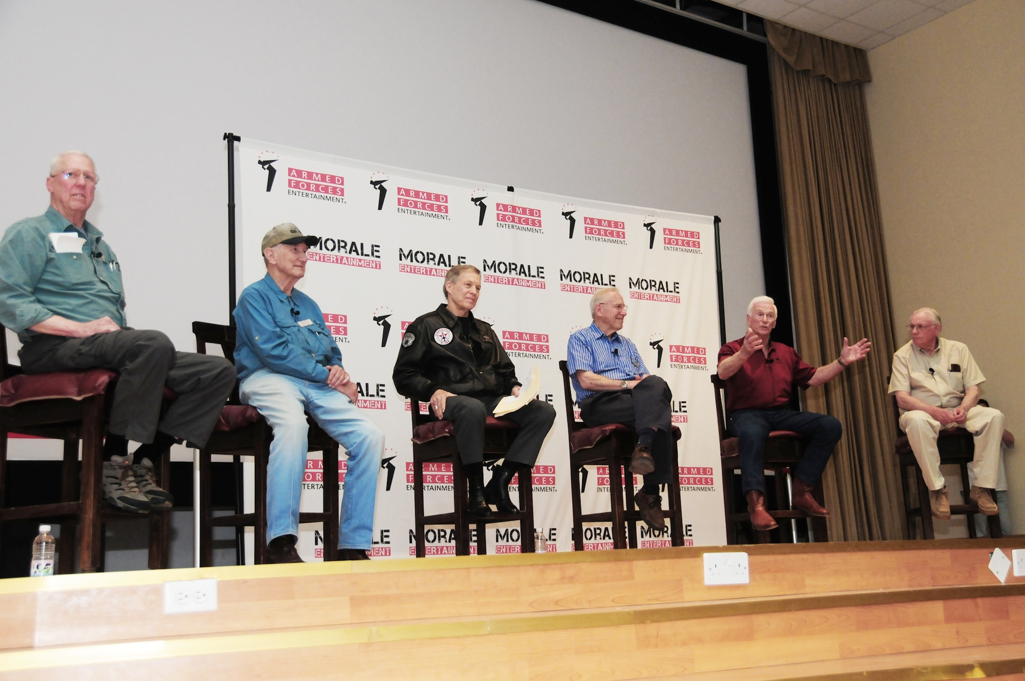 TV personality David Hartman (from left) moderates the "Legends of Aerospace" panel discussion March 7, 2010, featuring test pilot Bob Gilliland, retired Brig. Gen. Steve Ritchie, retired Navy Capt. Jim Lovell, retired Navy Capt. Gene Cernan and astronaut Neil Armstrong at an air base in Southwest Asia. During the panel discussion, the visitors shared their groundbreaking aviation and aerospace experiences. The visit was part of the "Legends of Aerospace" tour visiting various military installations throughout Europe and Southwest Asia. (U.S. Air Force photo/Staff Sgt. Lakisha A. Croley)