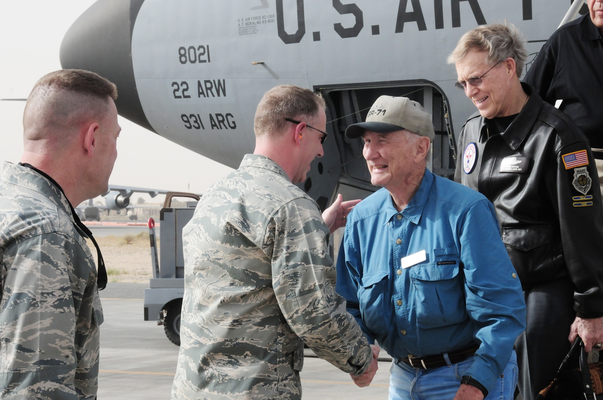 Col. John R. Gordy II, 386th Air Expeditionary Wing commander, welcomes retired test pilot Bob Gilliland, retired Brig. Gen. Steve Ritchie and other "Legends of Aerospace" March 7, 2010, as they arrive at an air base in Southwest Asia.  The "Legends of Aerospace" are touring military installations throughout Europe and Southwest Asia to share their groundbreaking aviation and aerospace experiences with servicemembers serving overseas. (U.S. Air Force photo/Staff Sgt. Lakisha A. Croley)