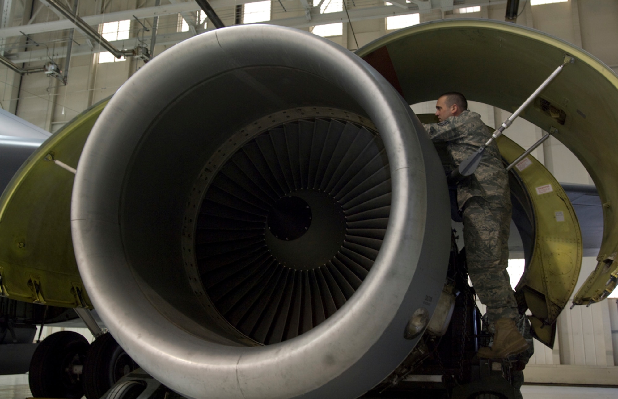 U.S. Air Force Tech. Sgt. Stefan Sianis, 22nd Aircraft Maintenance Squadron mechanic, inspects a KC-135R Stratotanker F108-100 engine before it is lowered from the aircraft. Once removed, the engine will be sent to the 76th Propulsion Maintenance Group at Tinker Air Force Base, Okla., for refurbishment. After 26 years of service, the engine serial number 711107 is the last original F108 engine to be refurbished. (U.S. Air Force photo/Senior Airman Abigail Klein)