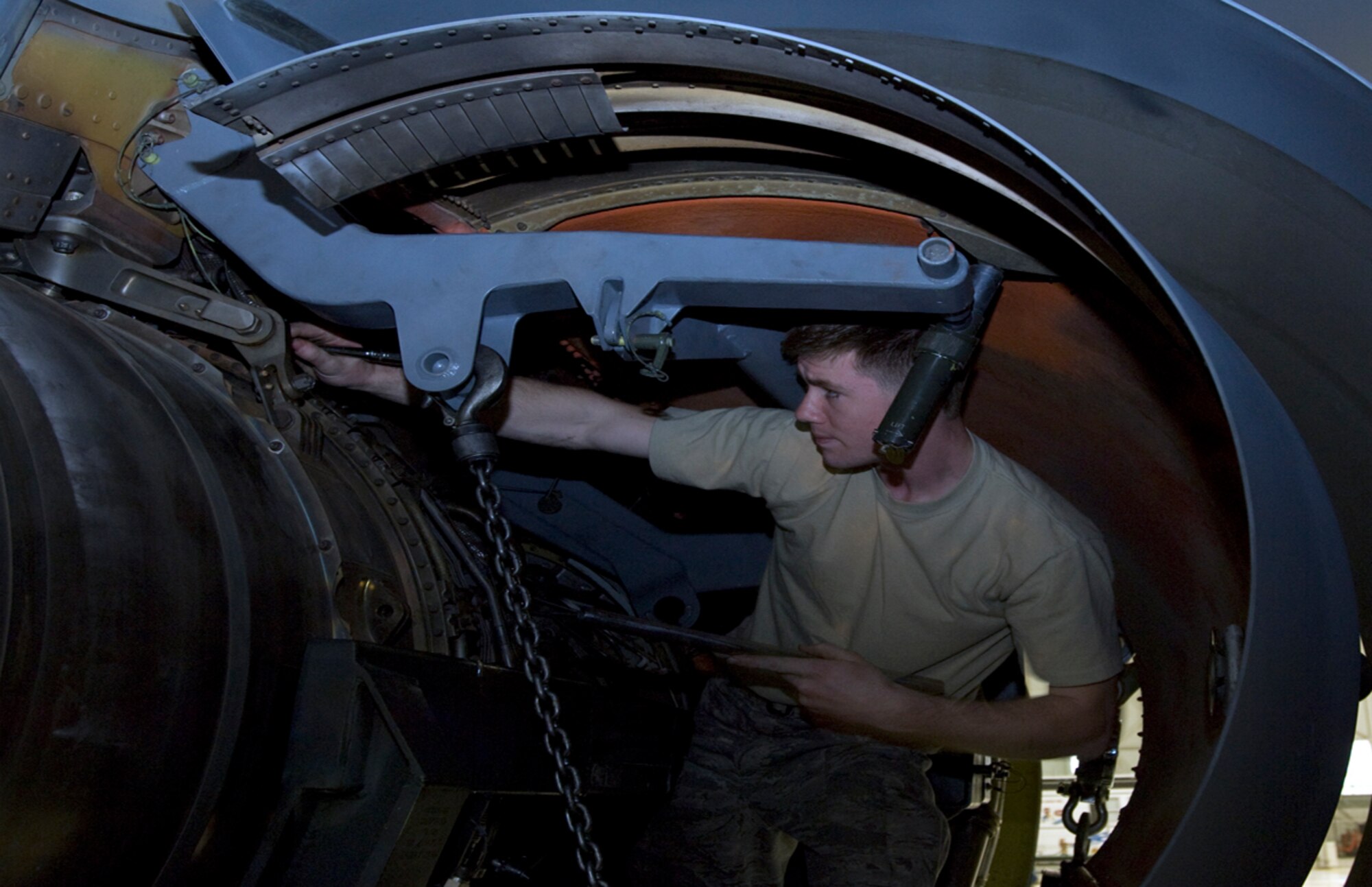 U.S. Air Force Airman 1st Class Richard Baker, 22nd Aircraft Maintenance Squadron mechanic, loosens bolts mounting a KC-135R Stratotanker F108-100 engine that will be sent to Tinker Air Force Base, Okla., to be refurbished. After 26 years of service, the engine, serial number 711107, is the last F108 engine to be refurbished. Four Airmen from the 22nd AMXS Squadron helped remove the 8,000 pound engine. (U.S. Air Force photo/Senior Airman Abigail Klein)