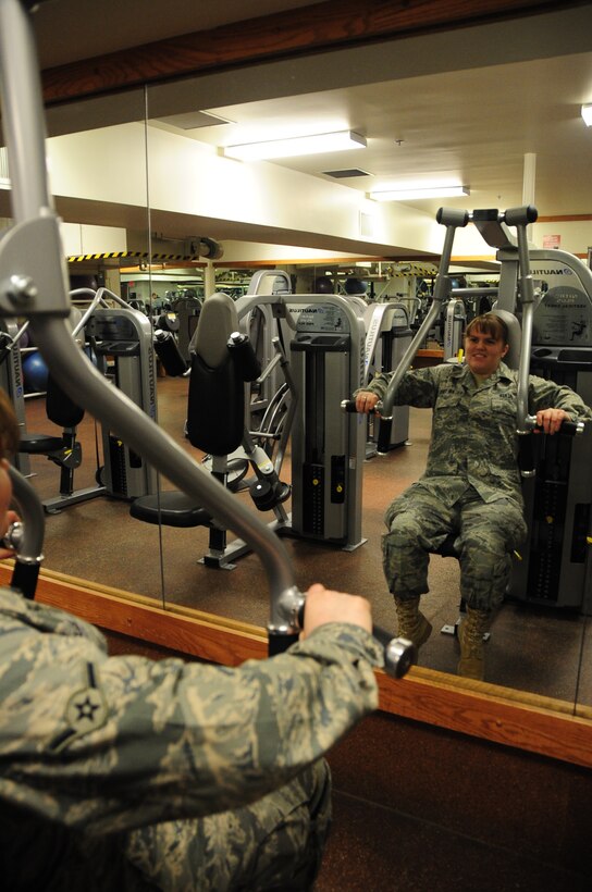 ELLSWORTH AIR FORCE BASE, S.D. -- Airman Kaitlin Walker, 28th Bomb Wing radio and television broadcaster, bench presses as much weight as she can during a fitness assessment, March 9.  The bench press was one of six events, which test an individual's level of fitness and provide a benchmark for developing a personalized fitness program. (U.S. Air Force photo/Airman 1st Class Anthony Sanchelli)
