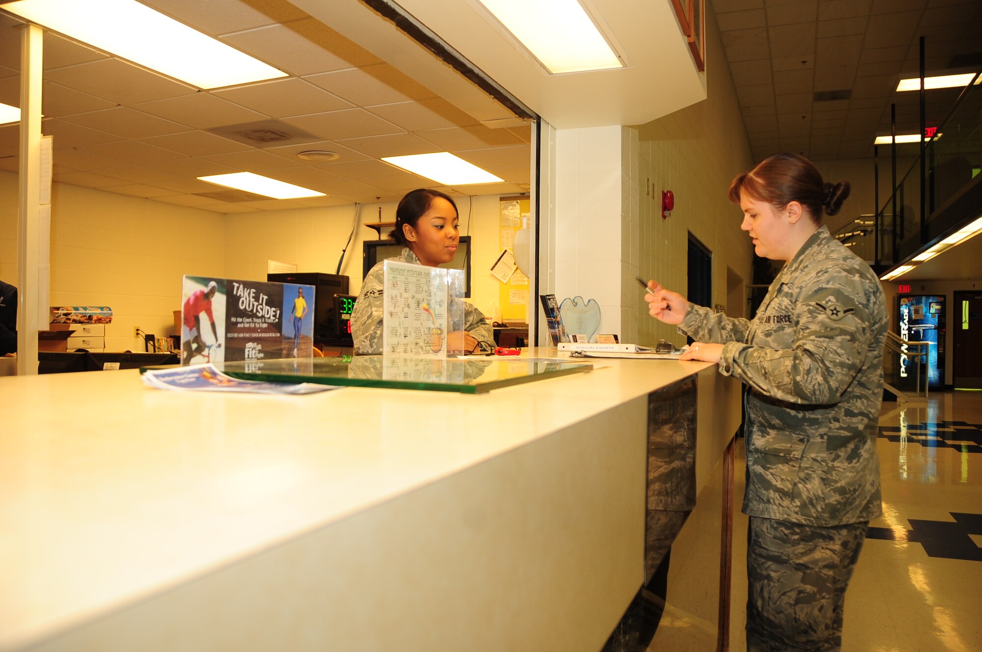 ELLSWORTH AIR FORCE BASE, S.D. -- (Left to right) Airman 1st Class Elimae Gilchrist, 28th Force Support Squadron fitness specialist, works with Airman Kaitlin Walker, 28th Bomb Wing radio and television broadcaster, on a fitness assessment for Airman Walker, March 9.  The assessments are designed to help an individual develop a fitness plan based on their level of physical fitness. (U.S. Air Force photo/Airman 1st Class Anthony Sanchelli)
