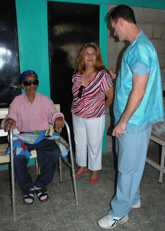 Lorenzo Amador, an 87-year-old Honduran, recovers from cataract surgeries that repaired his eyesight, as his caretaker Edita Rivera speaks with Army Dr. (Lt. Col.) . John Thordsen in Choluteca, Honduras, March 9. A combined team of U.S. military and Honduran medical personnel are conducting a humanitarian civic assistance eye surgical campaign Feb. 22 - March 13 in Choluteca's Hospital Del Sur, where they will perform eye surgeries for hundreds of Hondurans in need. (U.S. Air Force photo by 1st Lt. Jennifer Richard)  