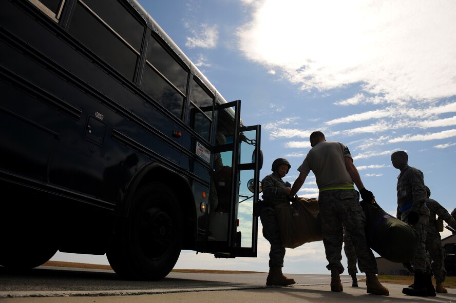MOODY AIR FORCE BASE, Ga. -- Airmen offload from a bus at the Deployment Control Center during a Phase I Operational Readiness Inspection here March 9. During this inspection, the 23rd Wing was tested on its ability to rapidly deploy. (U.S. Air Force photo by Senior Airman Gina Chiaverotti-Paige)