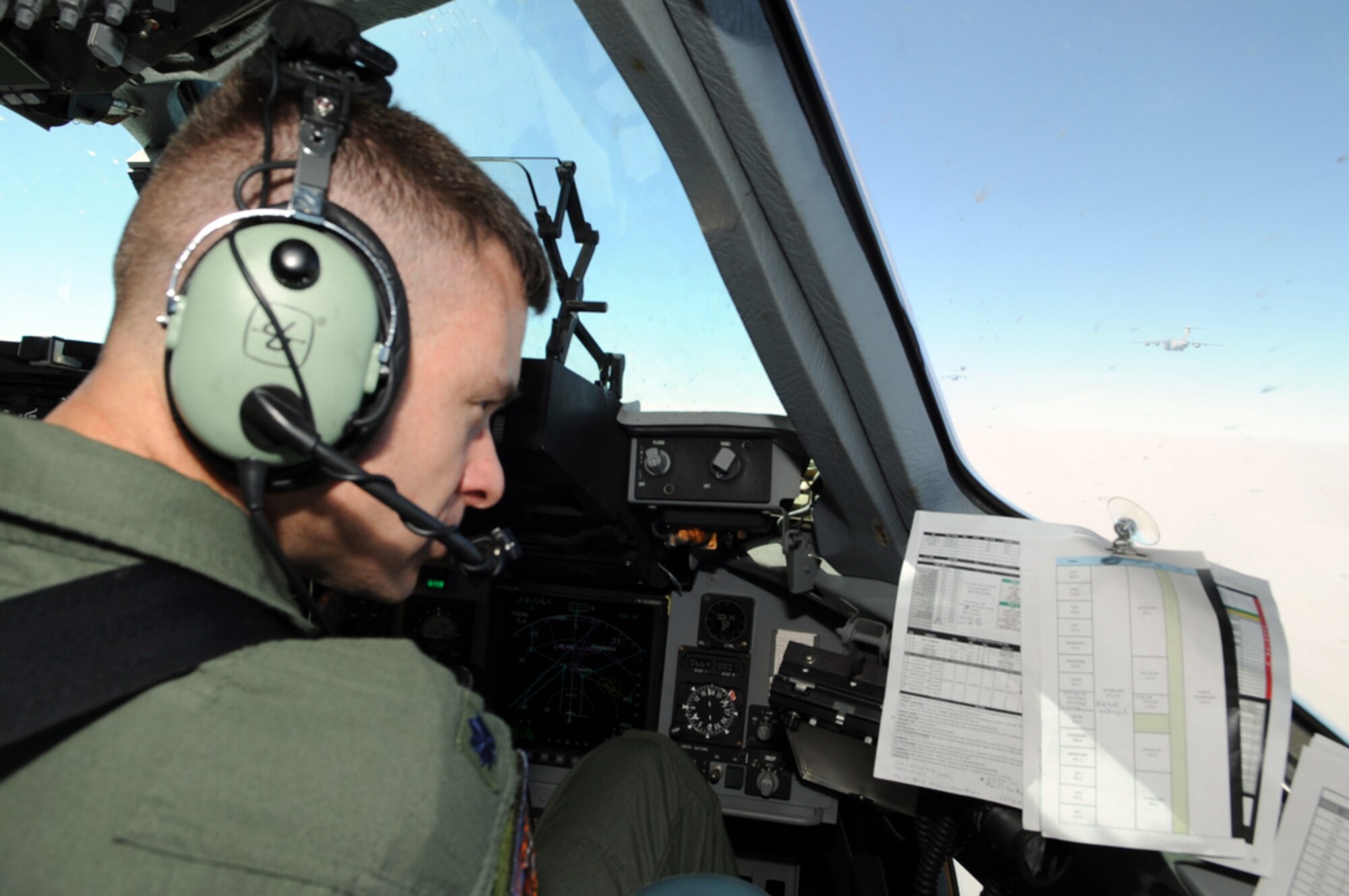 Lt. Col. Andy Hird reviews charts while participating in a C-17 Globemaster III three-ship formation as part of Cope Tiger 2010 March 8, 2010, in Thailand. Colonel Hird is the 517th Airlift Squadron commander at Elmendorf Air Force Base, Alaska. (U.S. Air Force photo/Tech. Sgt. Cohen A. Young)