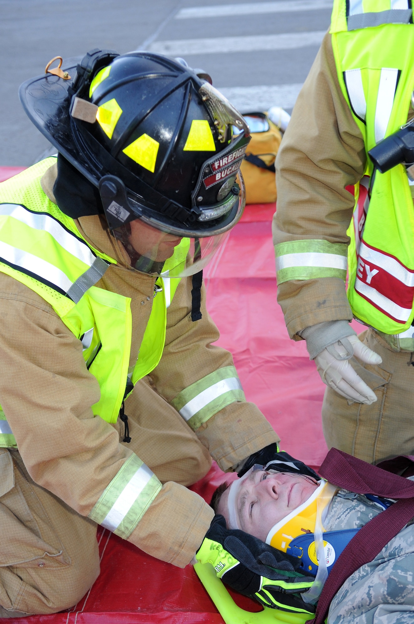 BUCKLEY AIR FORCE BASE, Colo. -- 460th Civil Engineer Squadron firefighters respond to an exercise car accident Feb. 25 as part of the Operational Readiness Inspection. (U.S. Air Force Photo by Airman First Class Marcy Glass)
