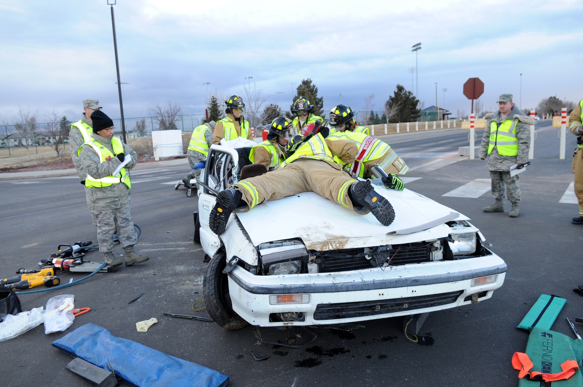 BUCKLEY AIR FORCE BASE, Colo. -- 460th Civil Engineer Squadron firefighters respond to an exercise car accident Feb. 25 as part of the Operational Readiness Inspection. (U.S. Air Force Photo by Airman First Class Marcy Glass)