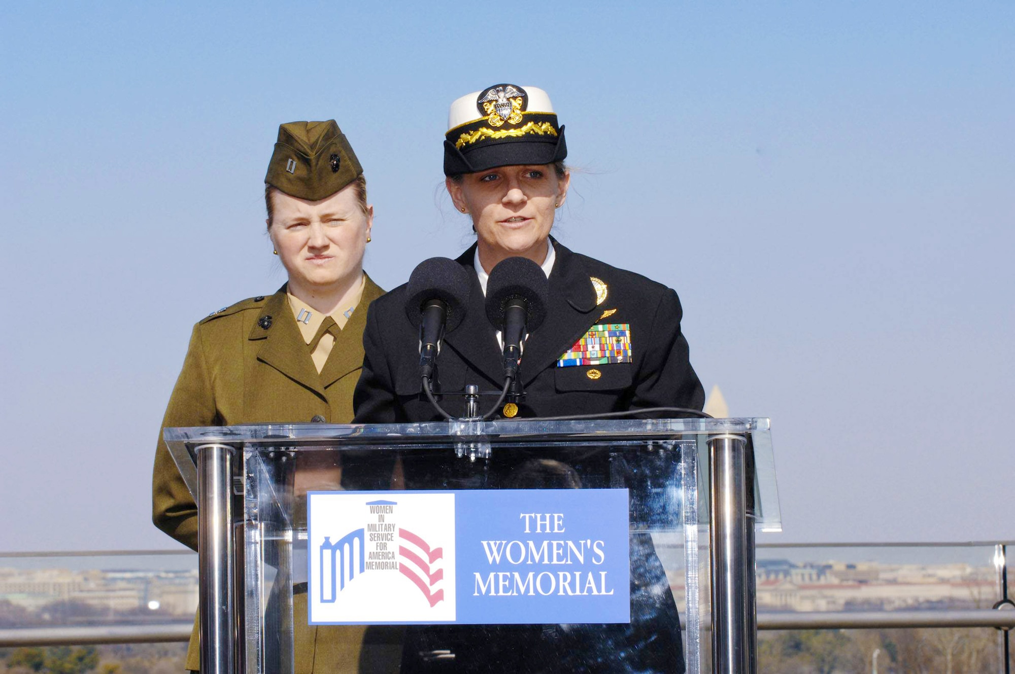 Navy Cmdr. Heidi Fleming (front) and Marine Corps Capt. Katherine Horner read the names of 38 Women Airforce Service Pilots members who perished during World War II while serving the Army Air Forces March 9, 2010 in Arlington, Va. (U.S. Air Force photo/Staff Sgt. Erica J. Knight)