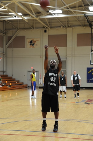 Gerald Dickson shoots a free throw during an intramural basketball game held at the Fitness and Sports Center here March 9. The 628th Security Forces Squadron outlasted the 437th Operations Support Squadron 41-36. Dickson is with the 628 SFS. (U.S. Air Force photo/Senior Airman Katie Gieratz)