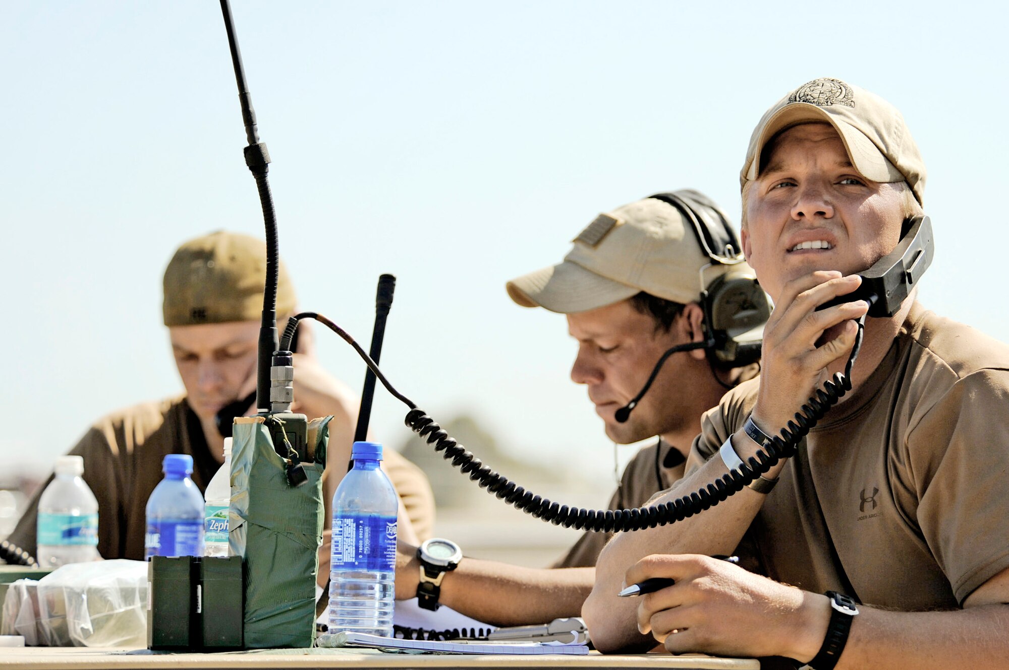 Combat controllers talk to aircraft circling the Toussaint L'Ouverture International Airport Jan. 23, 2010, in Port-au-Prince, Haiti. The Airmen are from the 23rd Special Tactics Squadron at Hurlburt Field, Fla. (U.S. Air Force photo/Staff Sgt. Desiree N. Palacios)